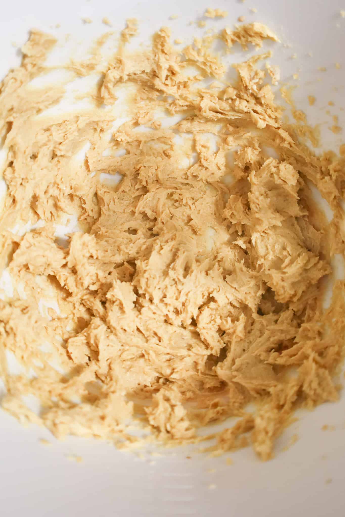 creamy cookie dough mixture in a mixing bowl