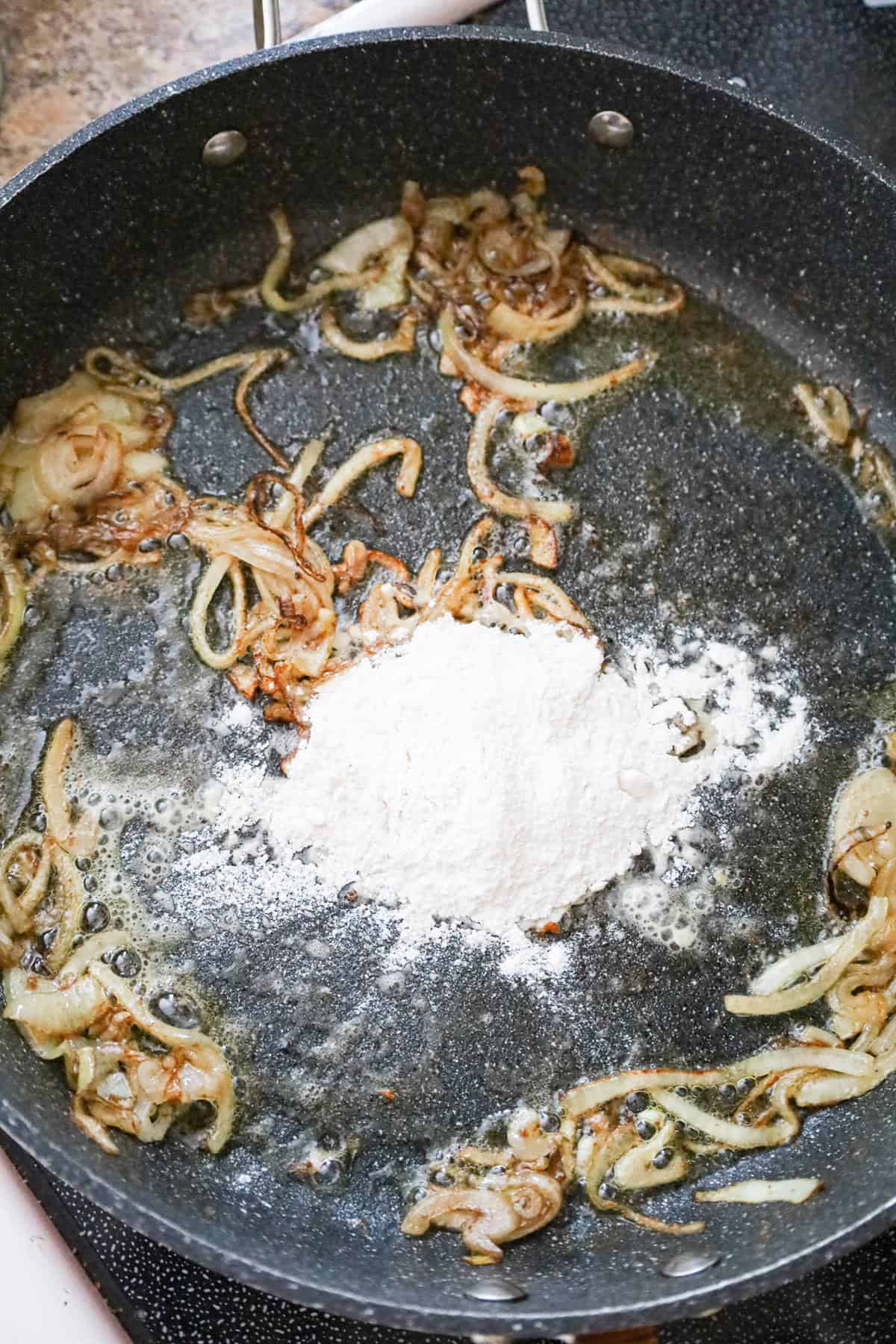 all purpose flour added to pan with melted butter and cooked onions