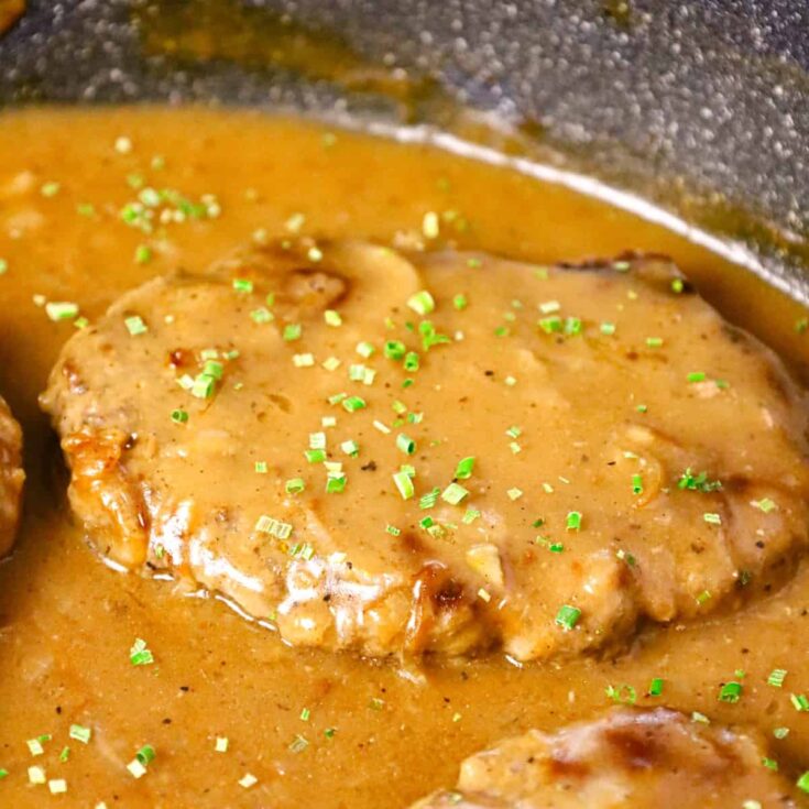 Hamburger Steak is an easy stove top dinner recipe of ground beef patties and onions cooked in brown gravy.