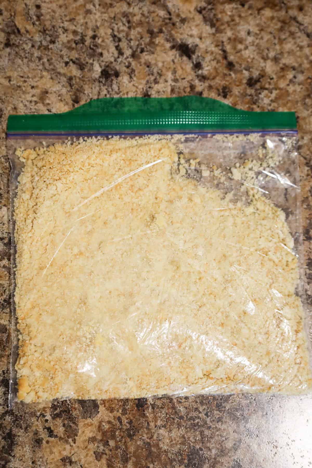 Ritz cracker crumbs in a Ziploc bag