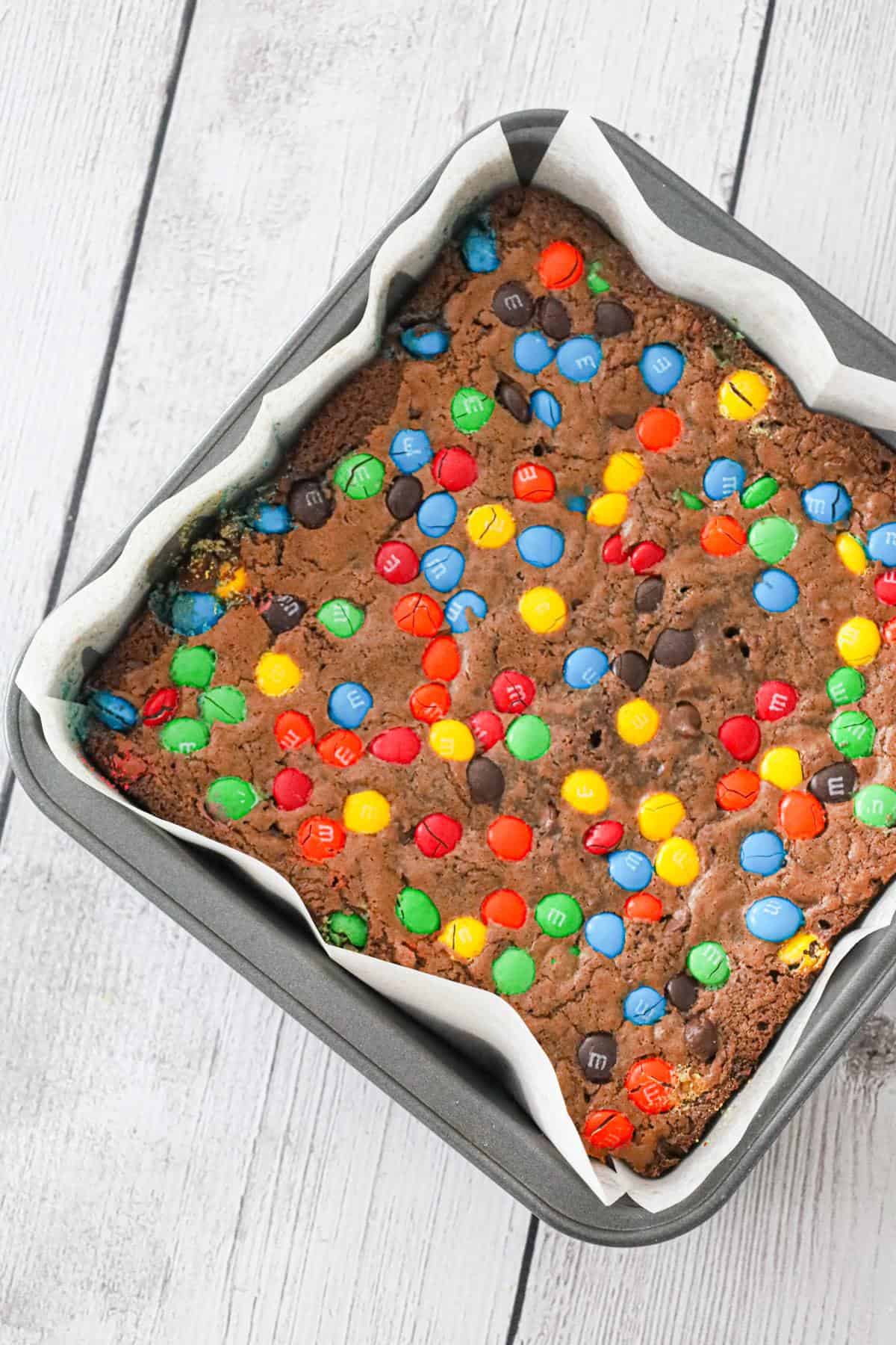 M&M Brownies are delicious fudgy brownies loaded with semi sweet chocolate chips and M&M's candies.