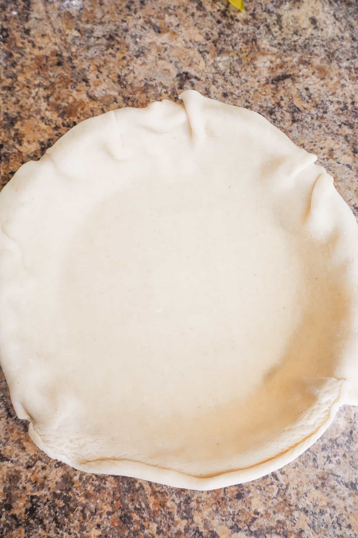 unbaked pie crust in a pie plate