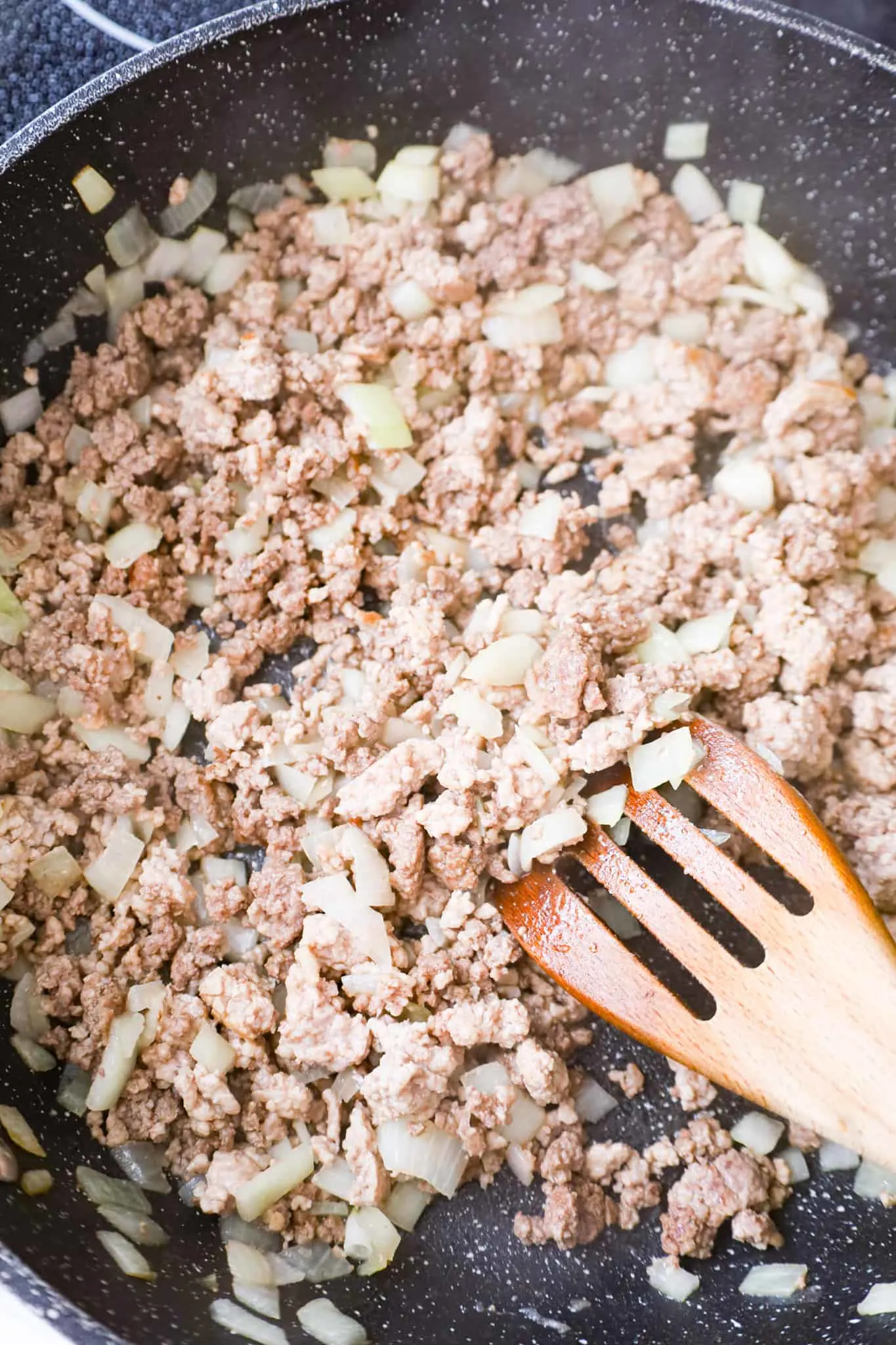 ground beef and ground pork cooking in a saute pan