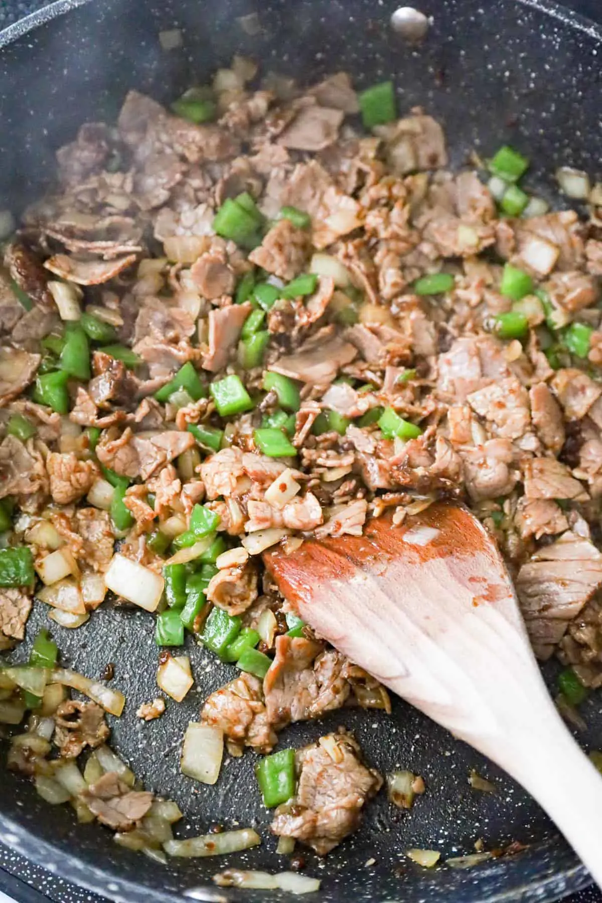 chopped roast beef, green peppers and onions tossed in beef gravy mix in a saute pan