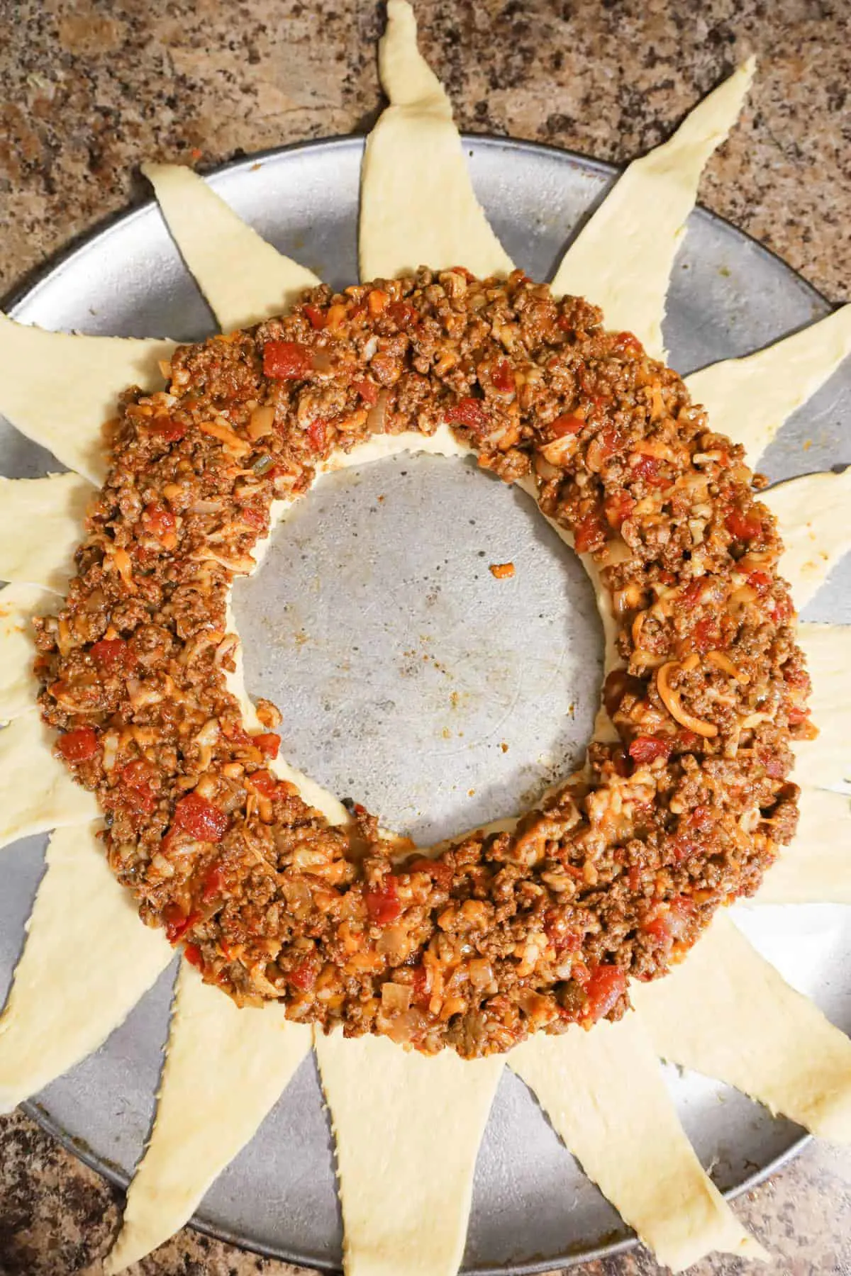ground beef mixture in a circle on crescent dough ring