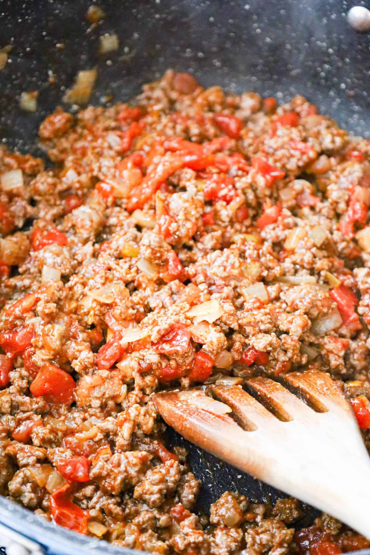 Rotel, taco seasoning and ground beef mixture in a saute pan