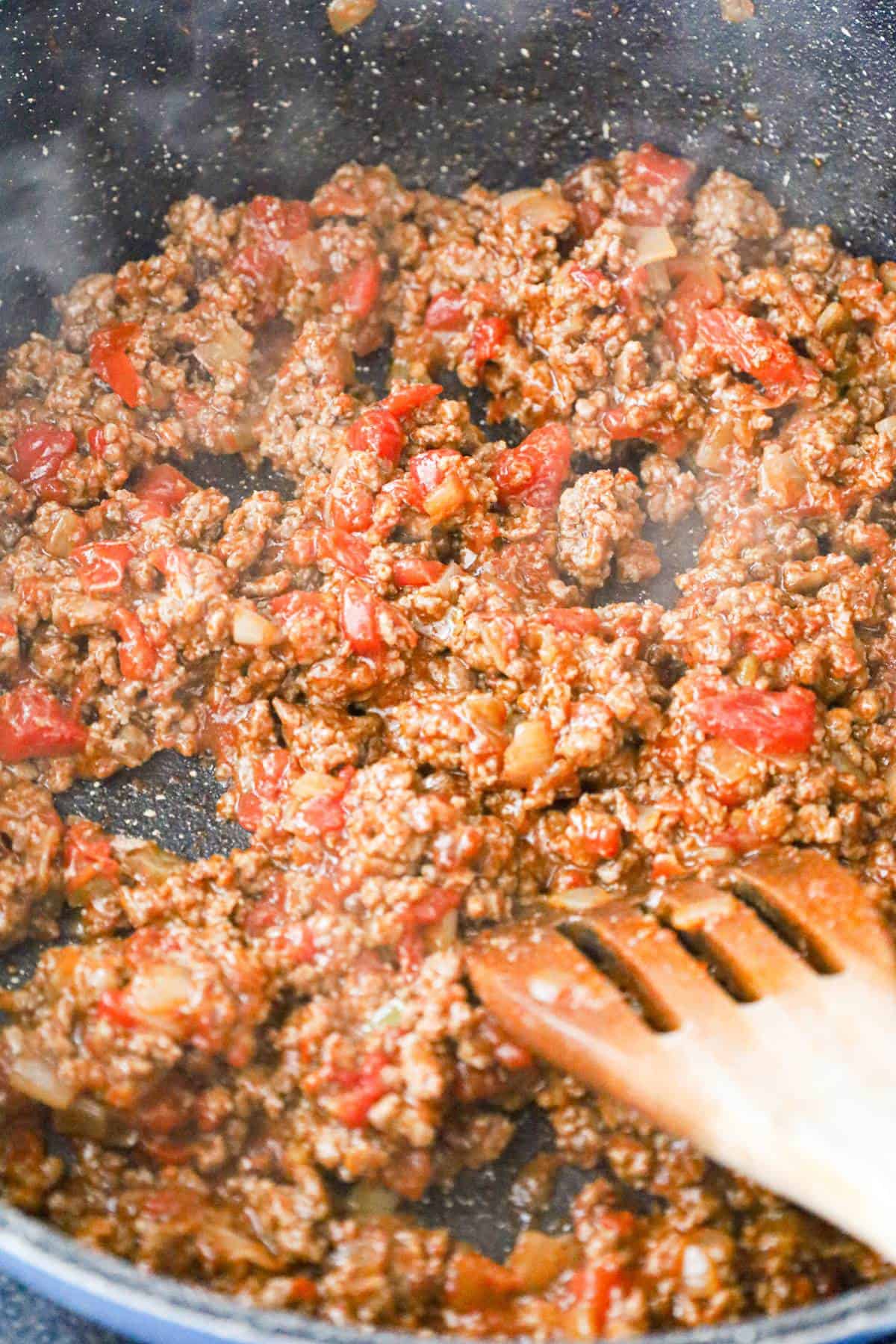 Rotel and ground beef mixture in a saute pan
