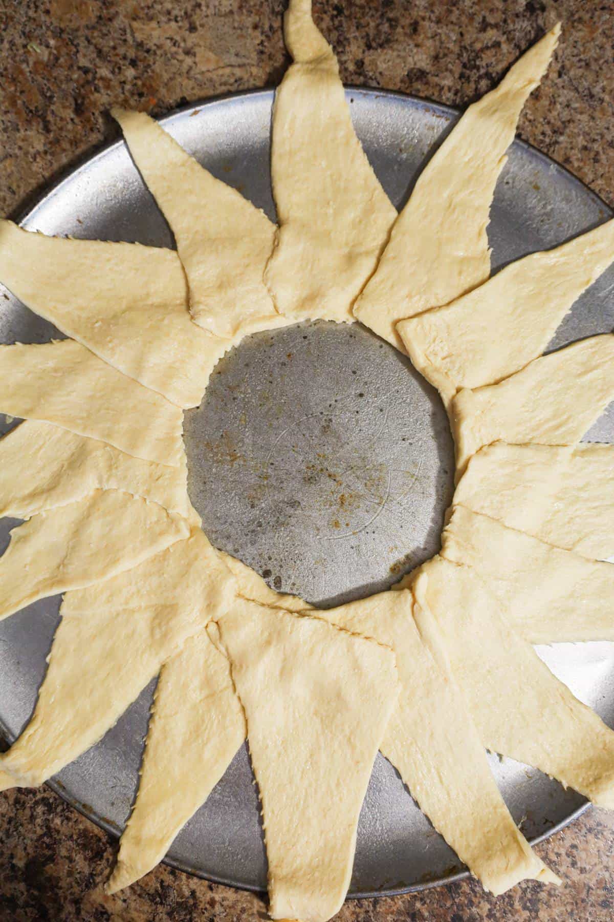 pillsbury crescent dough in a ring shape on a baking sheet
