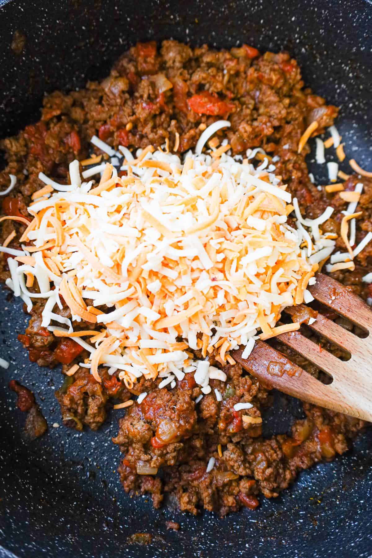 shredded cheese on top of ground beef