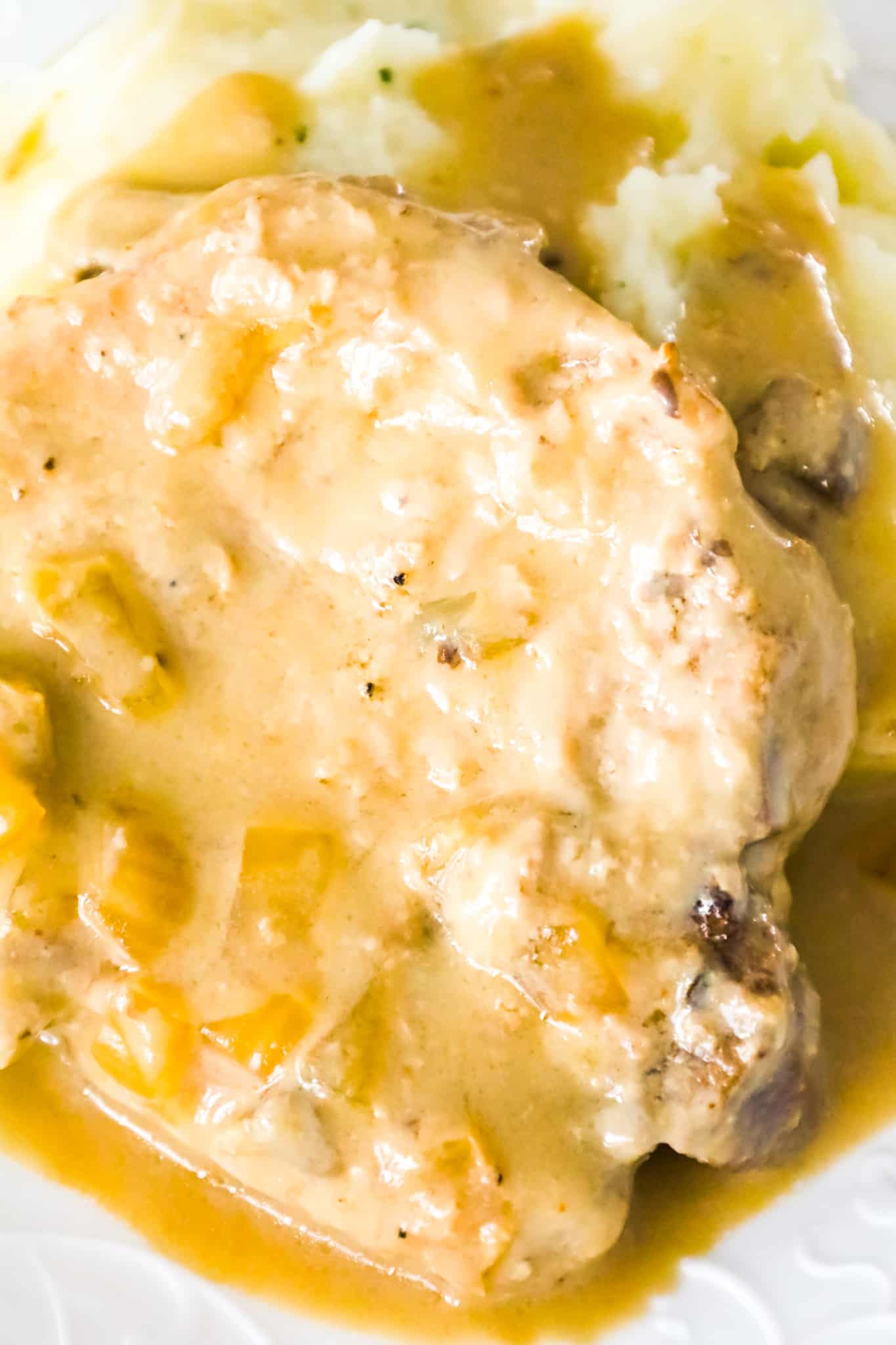 Crock Pot Pork Chops are a delicious slow cooker dinner recipe with bone in pork chops cooked in a creamy mushroom gravy.