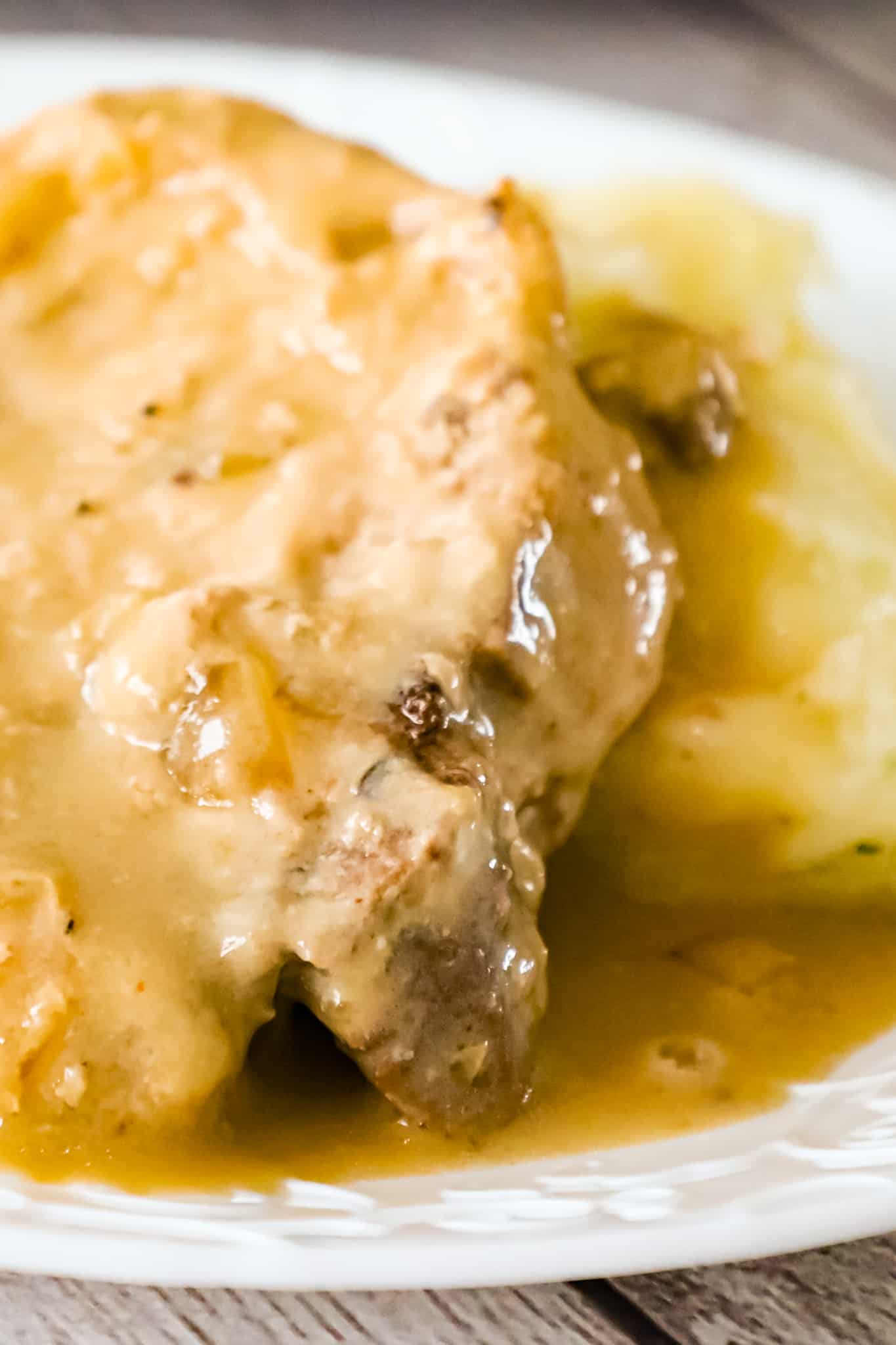 Crock Pot Pork Chops are a delicious slow cooker dinner recipe with bone in pork chops cooked in a creamy mushroom gravy.