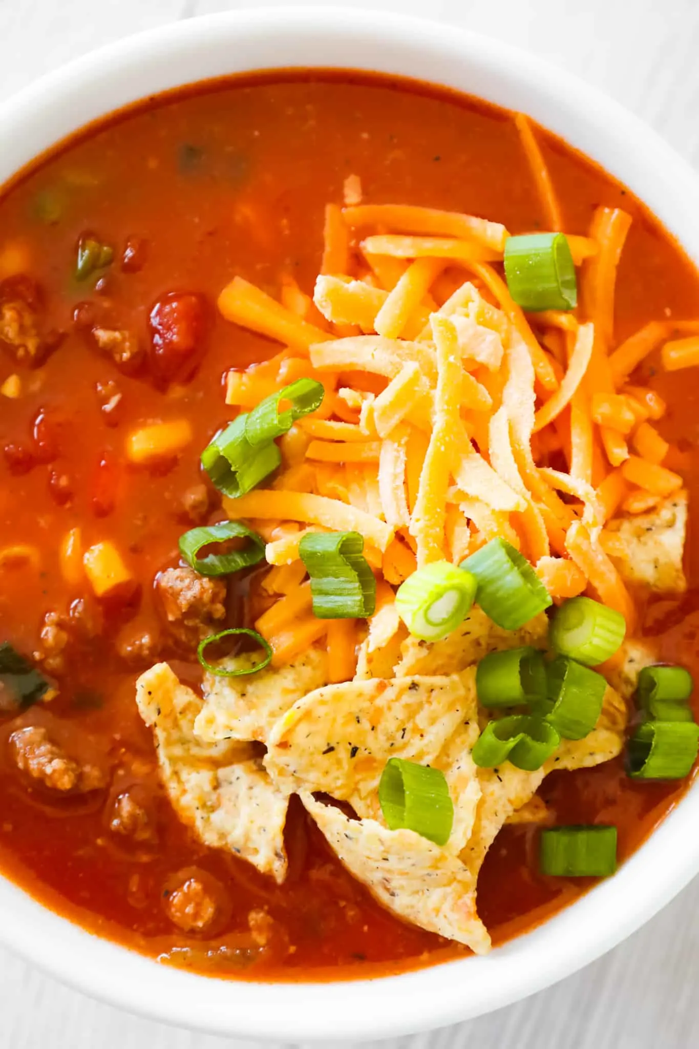 Crock Pot Taco Soup is an easy slow cooker soup recipe loaded with ground beef, Rotel diced tomatoes and green chilies, corn and chopped green onions.