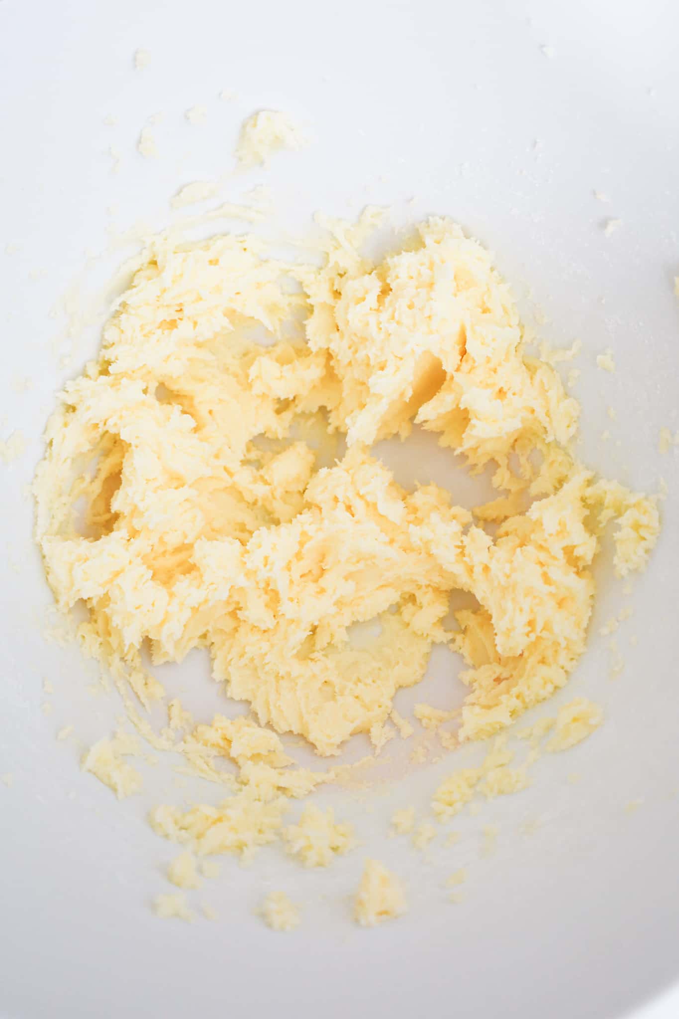 creamed butter and sugar mixture in a mixing bowl