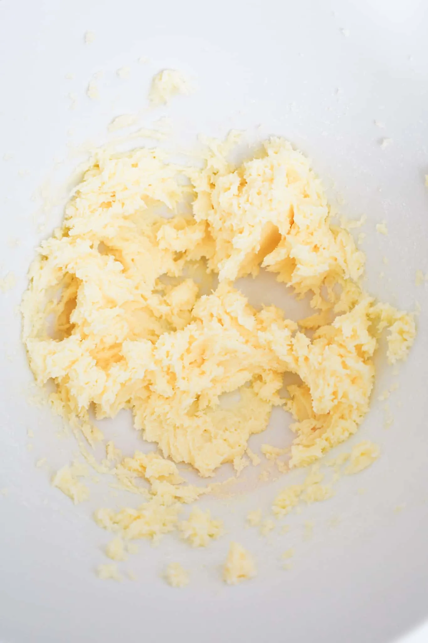 creamed butter and sugar mixture in a mixing bowl