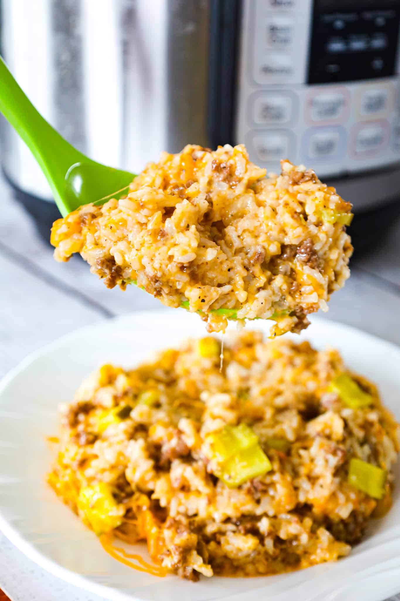 Instant Pot Big Mac Ground Beef and Rice is an easy pressure cooker dinner recipe made with long grain white rice and loaded with crumbled ground beef, diced dill pickles, mayo, Thousand Island dressing and shredded cheddar cheese.