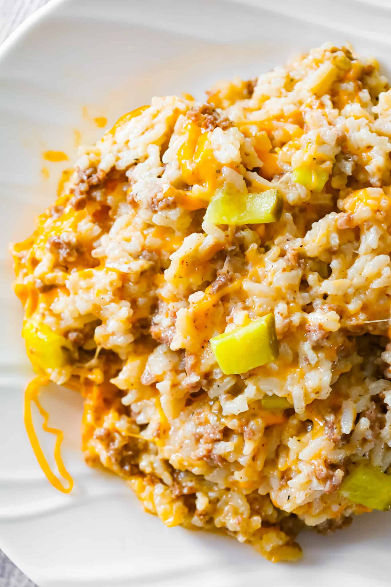 Instant Pot Big Mac Ground Beef and Rice is an easy pressure cooker dinner recipe made with long grain white rice and loaded with crumbled ground beef, diced dill pickles, mayo, Thousand Island dressing and shredded cheddar cheese.