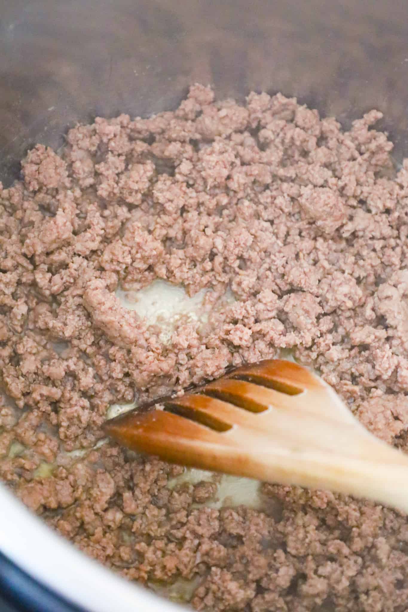 crumbled ground beef cooking in an Instant Pot