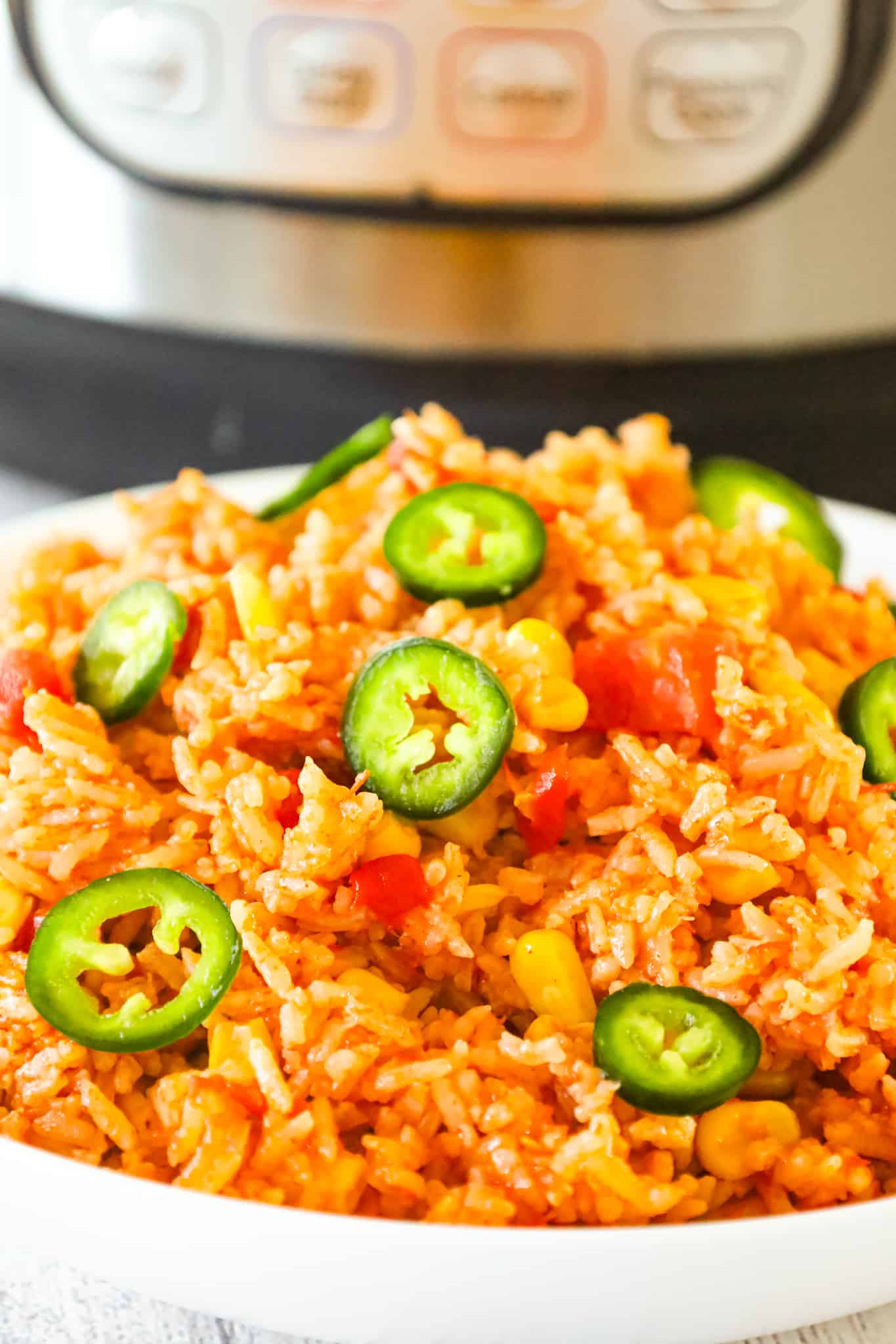 Instant Pot Spanish Rice is a delicious pressure cooker side dish recipe made with long grain white rice and loaded with Rotel diced tomatoes and green chilies, corn and flavourful spices.