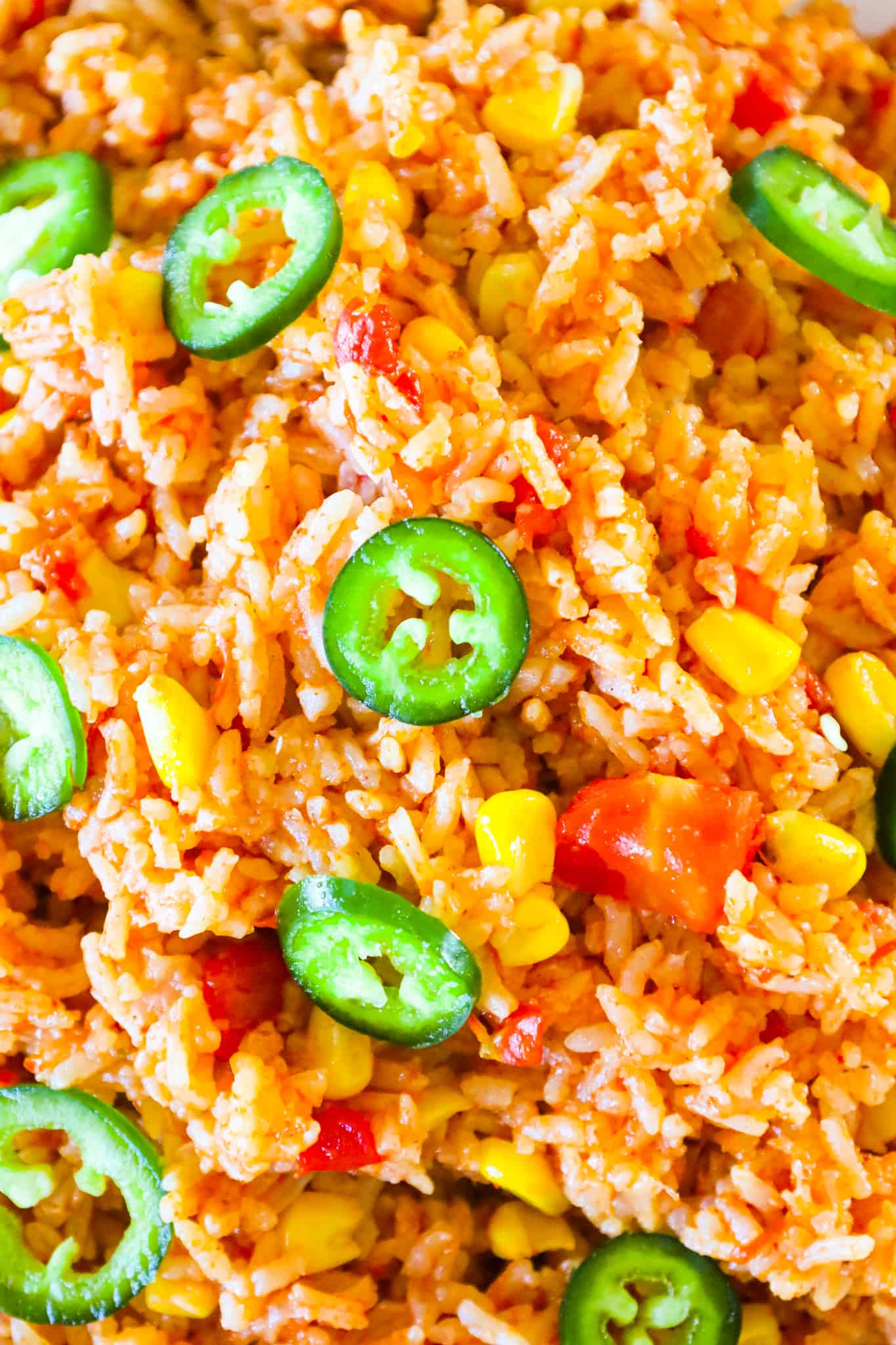 Instant Pot Spanish Rice is a delicious pressure cooker side dish recipe made with long grain white rice and loaded with Rotel diced tomatoes and green chilies, corn and flavourful spices.