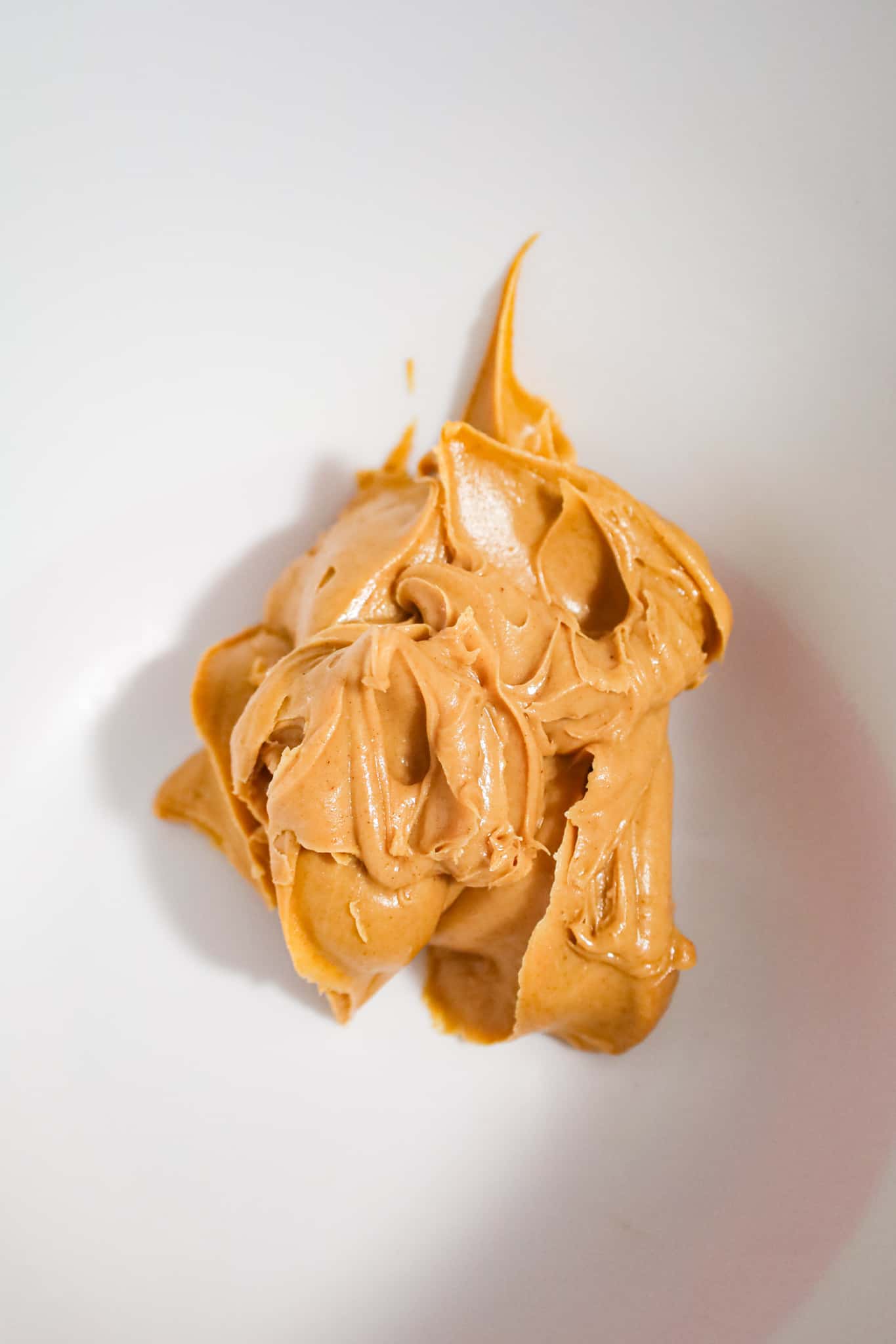 smooth peanut butter in a mixing bowl