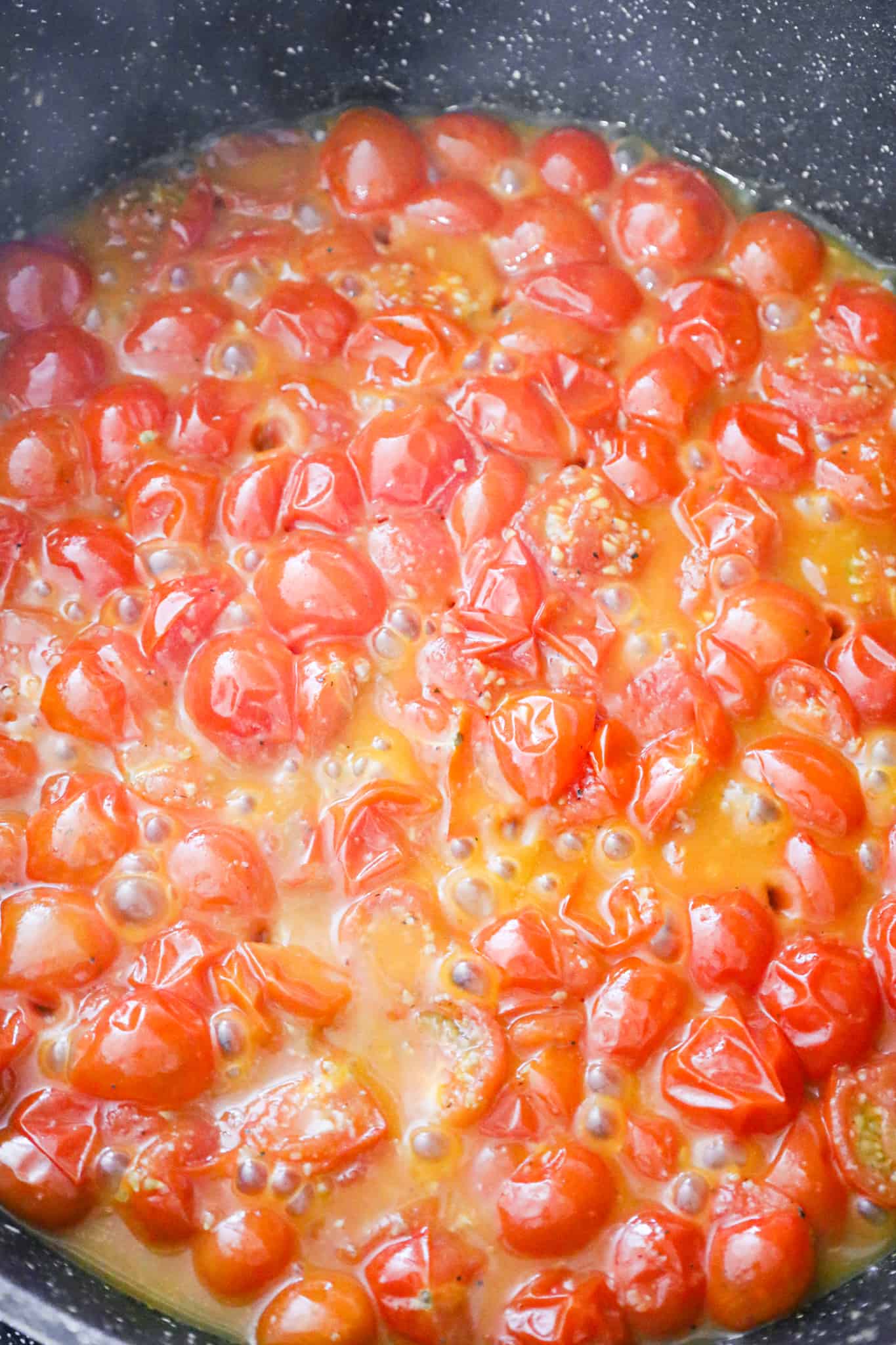 cooked cherry tomatoes into a saute pan