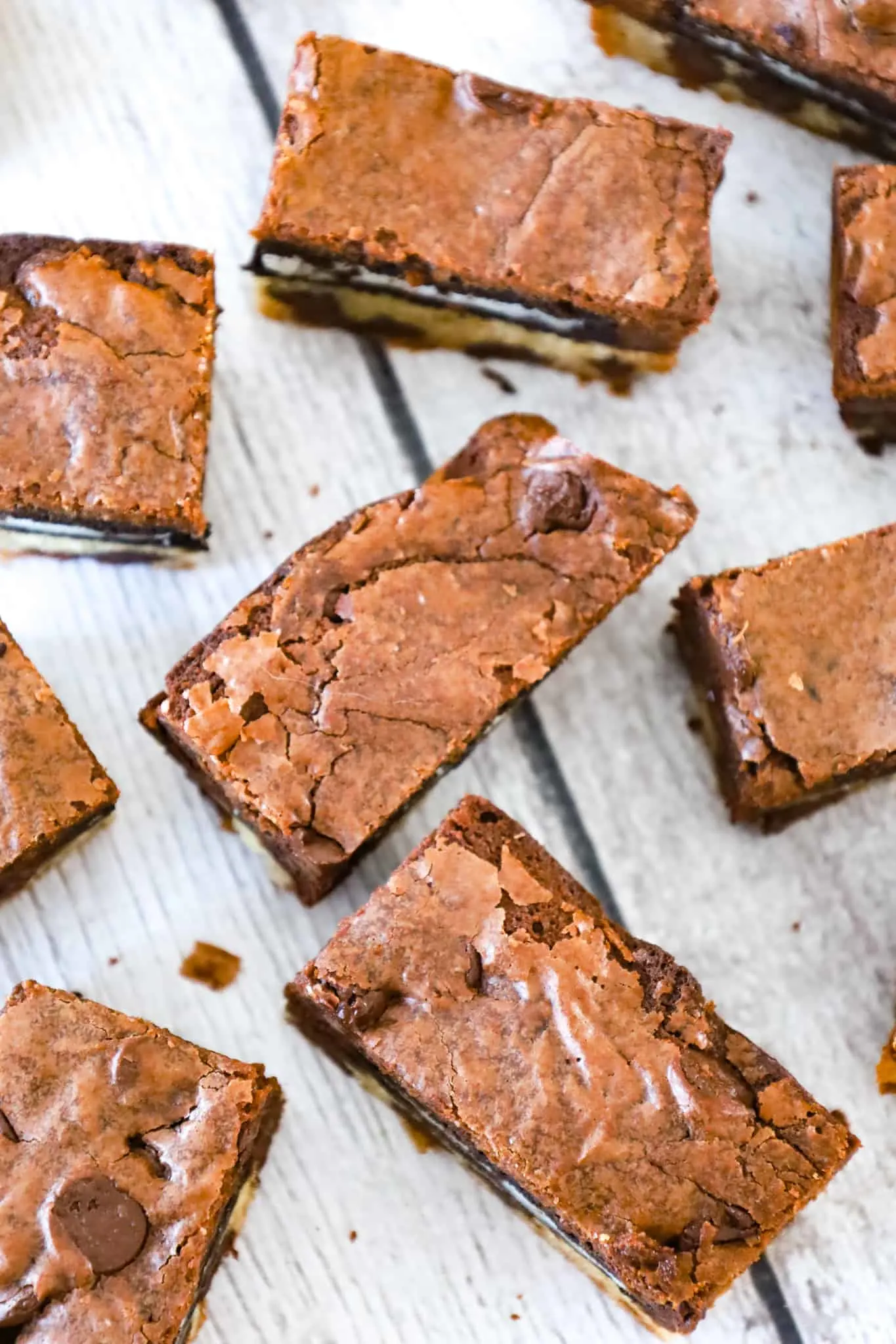 Slutty Brownies are delicious triple layer brownies with a chocolate chip cookie base, Oreo middle and chocolate brownie batter on top.