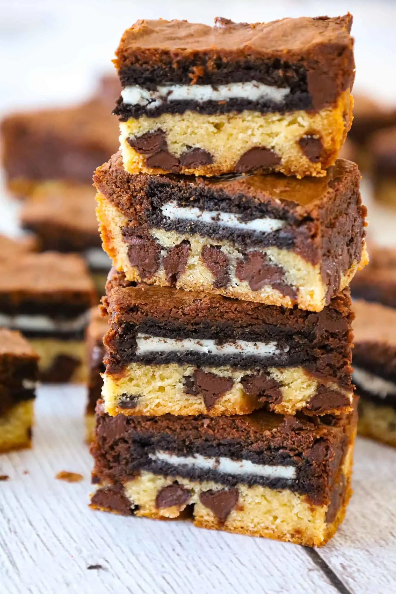 Slutty Brownies are delicious triple layer brownies with a chocolate chip cookie base, Oreo middle and chocolate brownie batter on top.