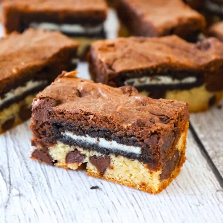 Slutty Brownies are delicious triple layer brownies with a chocolate chip cookie base, Oreo middle and chocolate brownie batter on top.