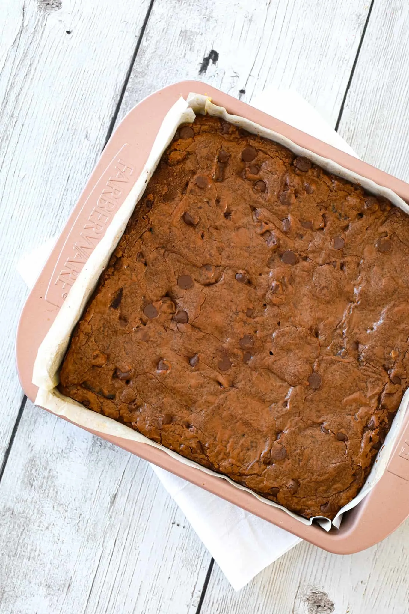 Slutty Brownies are delicious triple layer brownies with a chocolate chip cookie base, Oreo middle and chocolate brownie batter on top.