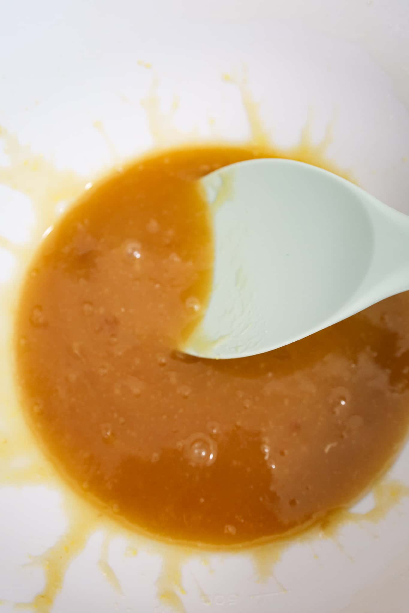 melted butter, brown sugar and egg mixture in a mixing bowl