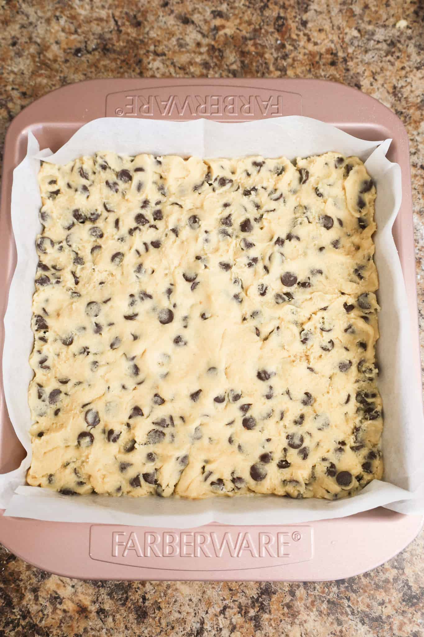 cookie dough in a parchment lined baking pan