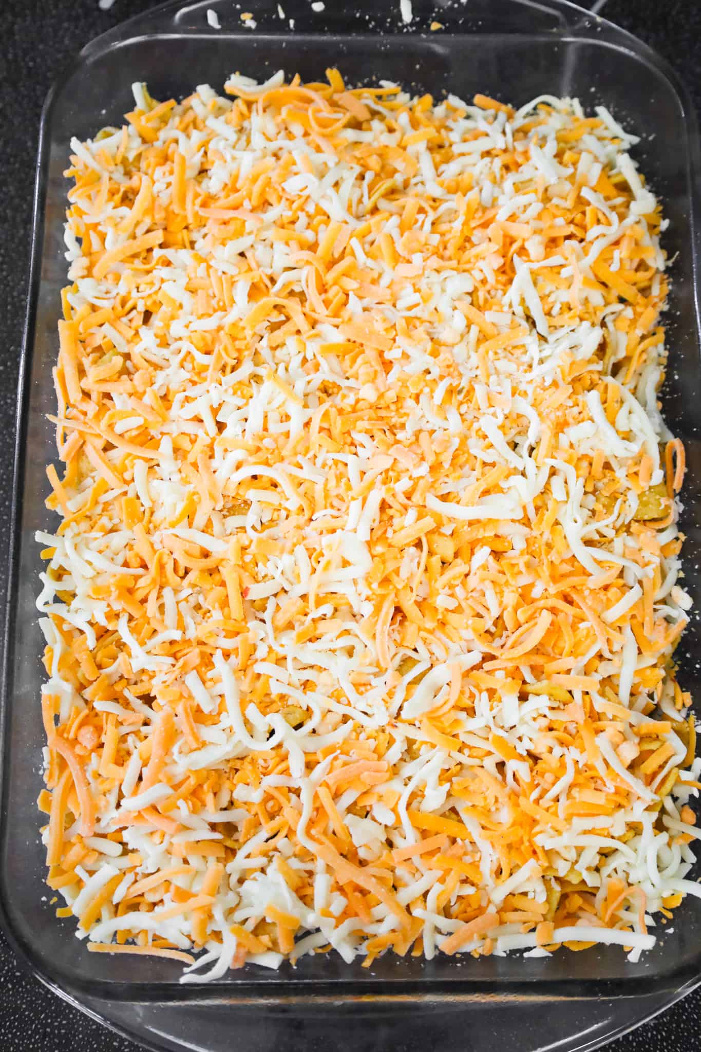 shredded cheese on top of taco casserole