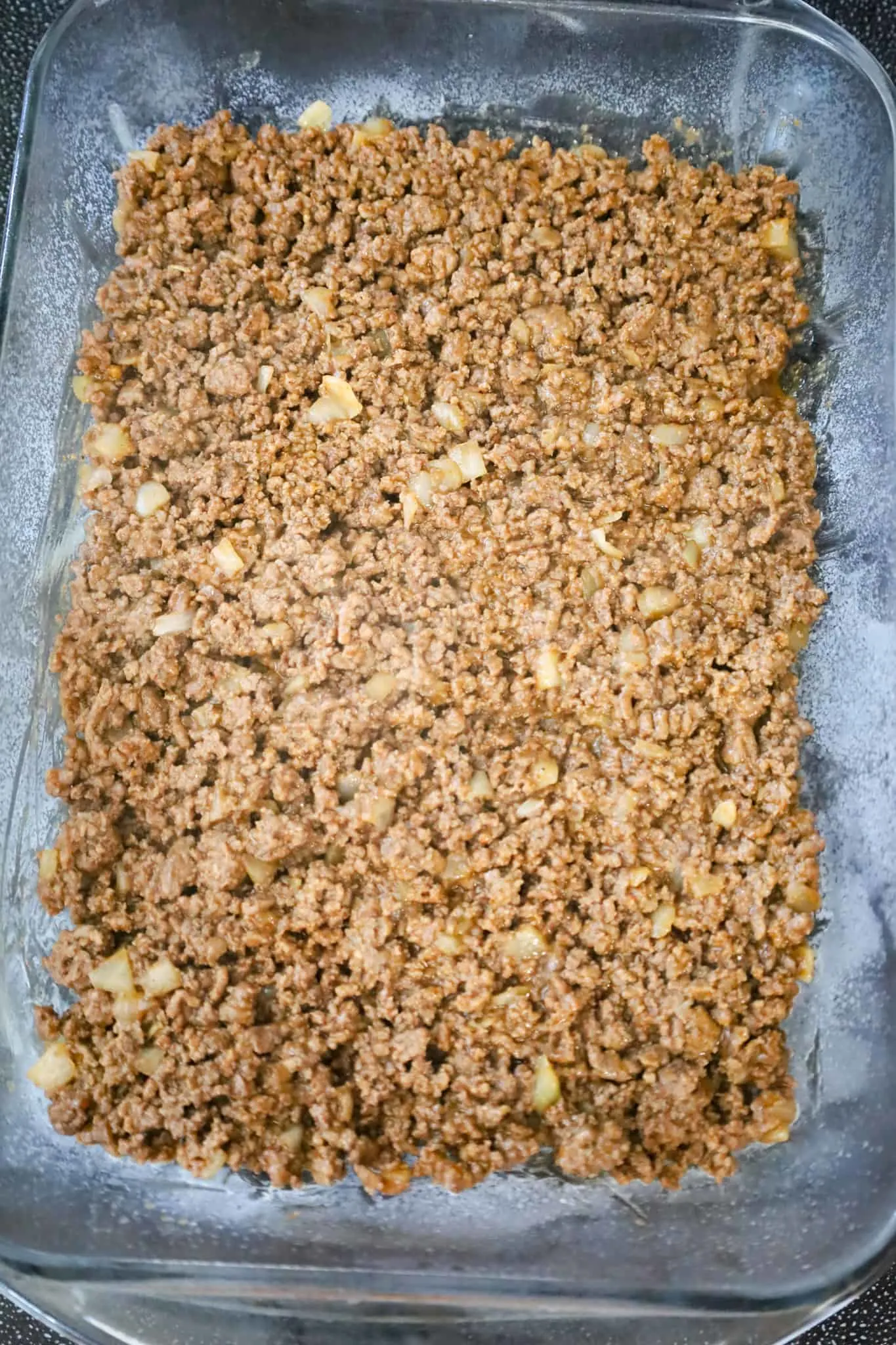 cooked taco ground beef in a baking dish