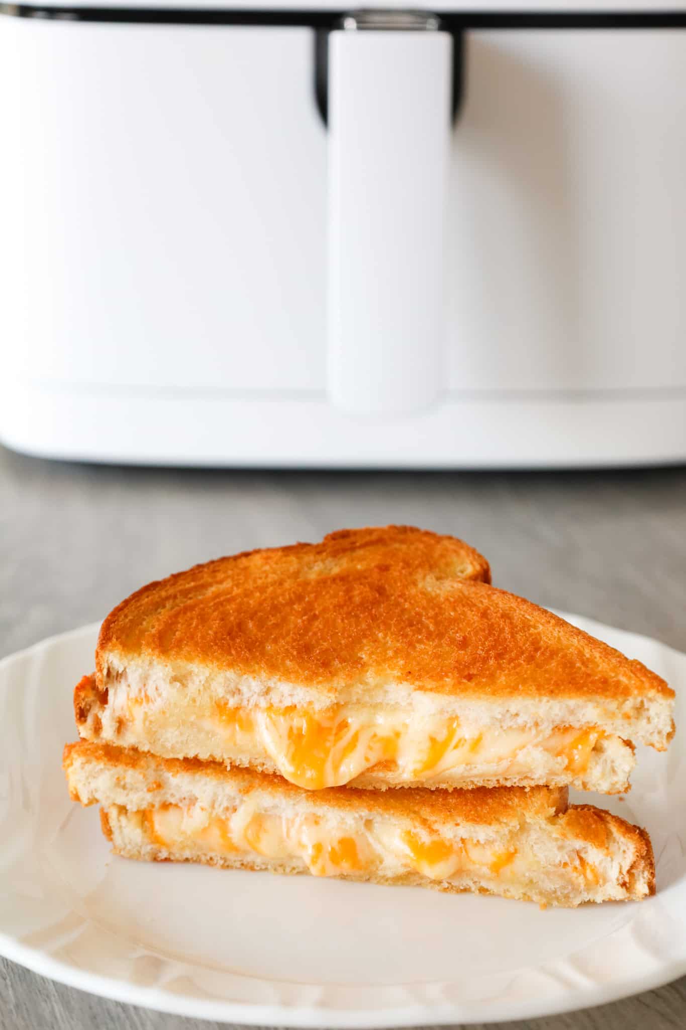 Air Fryer Grilled Cheese is an easy lunch or dinner recipe and results in a crispy sandwich with perfectly melted cheese.