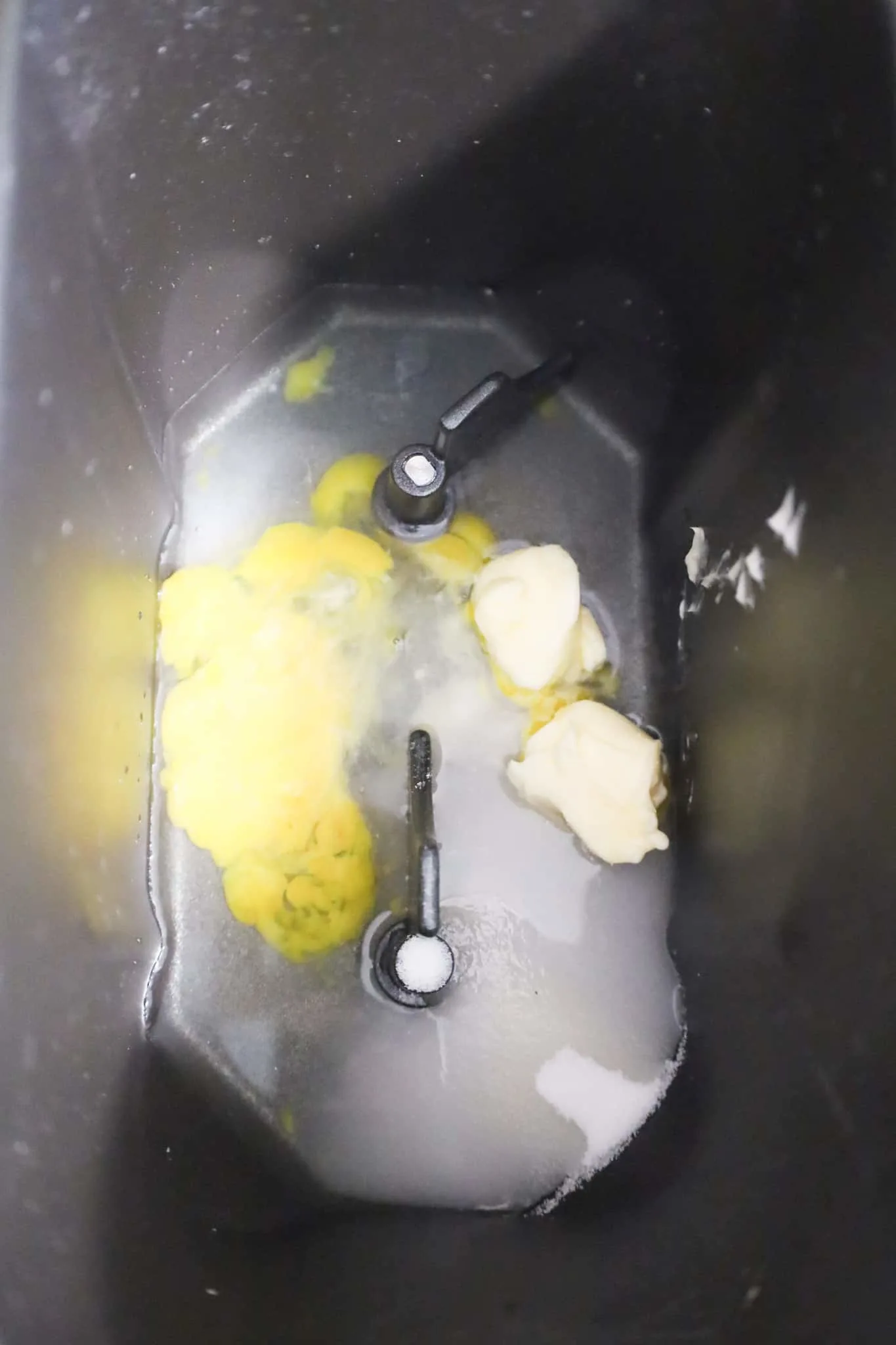 beaten egg, water, softened butter and sugar in a bread machine pan