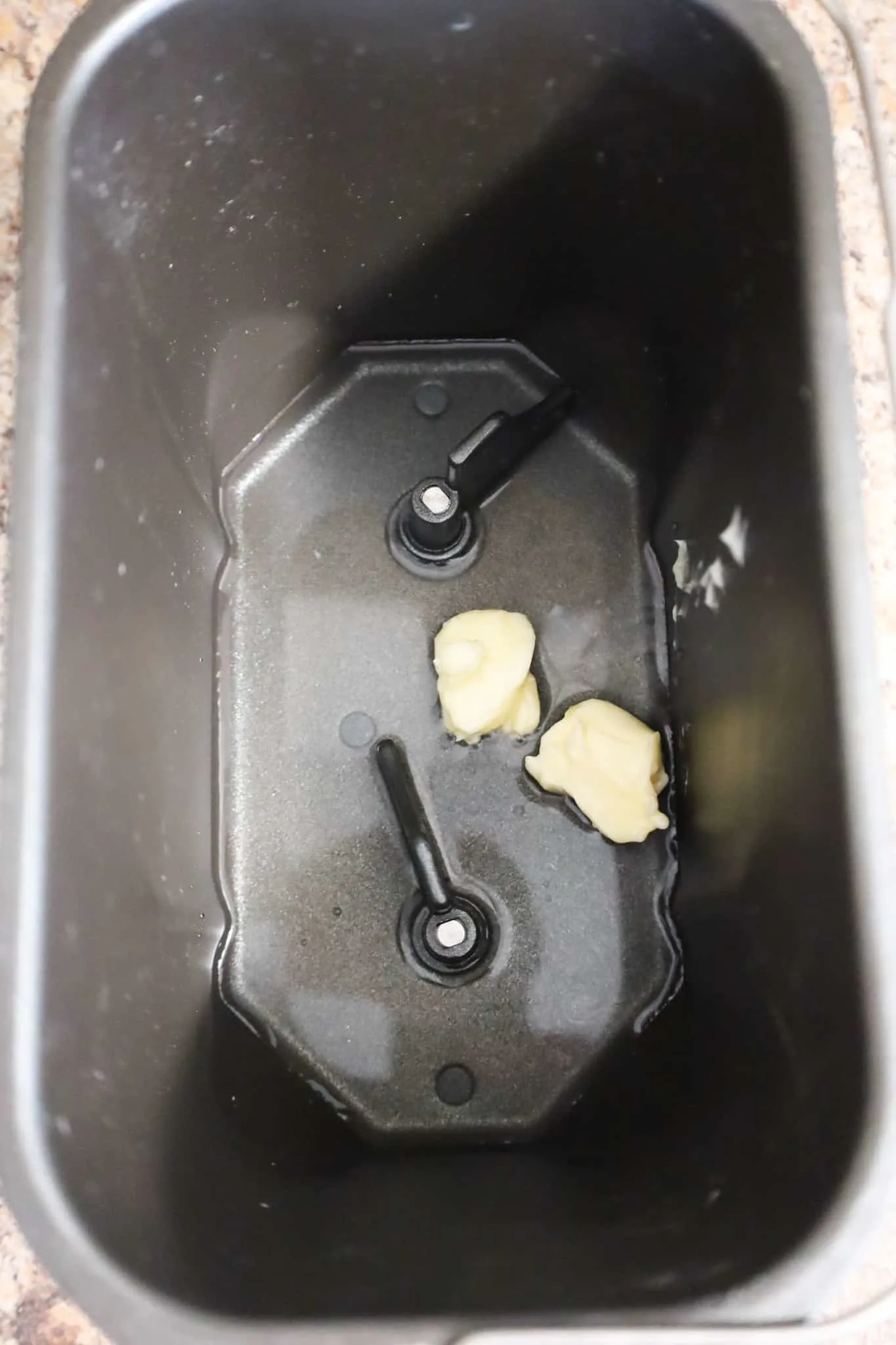 water and softened butter in a bread machine pan