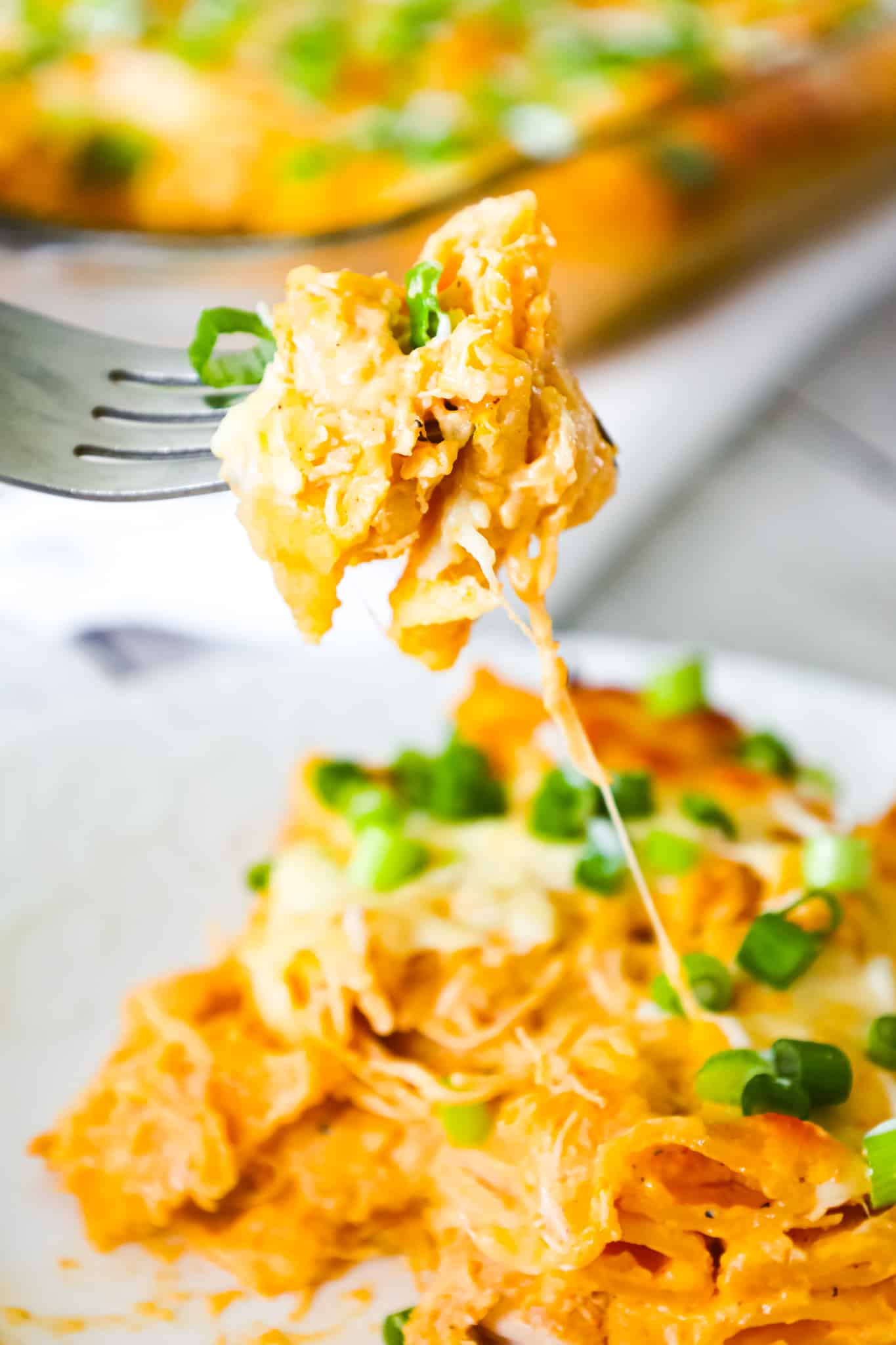Buffalo Chicken Pasta Bake is a creamy baked penne pasta recipe loaded with shredded rotisserie chicken, cream cheese, Buffalo sauce, ranch dressing, parmesan cheese and mozzarella cheese.