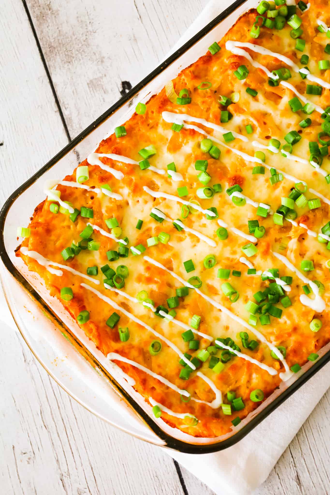 Buffalo Chicken Pasta Bake is a creamy baked penne pasta recipe loaded with shredded rotisserie chicken, cream cheese, Buffalo sauce, ranch dressing, parmesan cheese and mozzarella cheese.