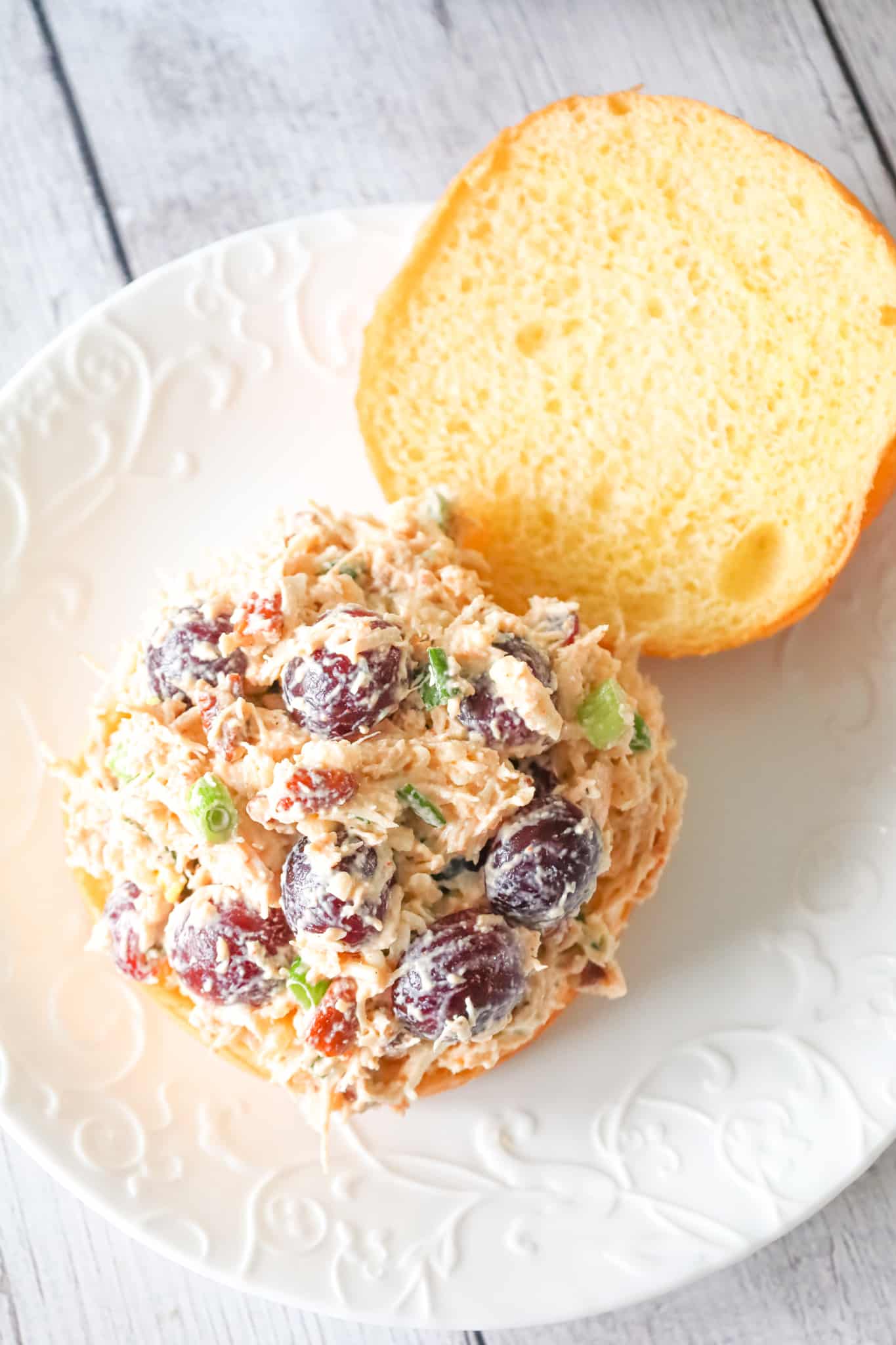 Chicken Salad with Grapes is a delicious lunch or dinner recipe using shredded rotisserie chicken and loaded with mayo, red grapes, pecans, chopped green onion and shredded mozzarella cheese.