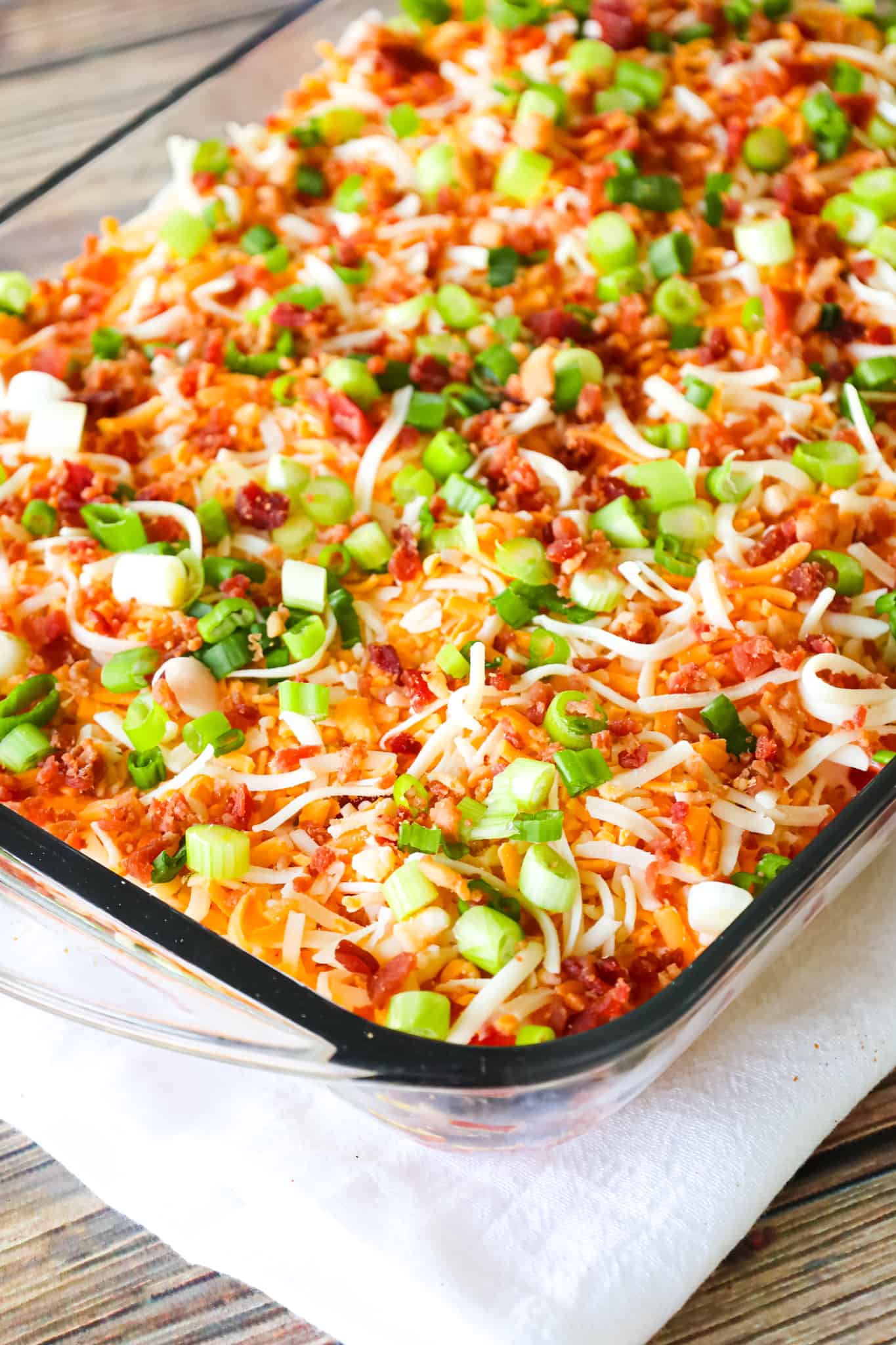 Cornbread Salad is a tasty side dish recipe loaded with cornbread pieces, diced tomatoes, diced bell peppers, corn, shredded cheese, chopped green onions, crumbled bacon and a dressing made from sour cream, ranch and salsa.