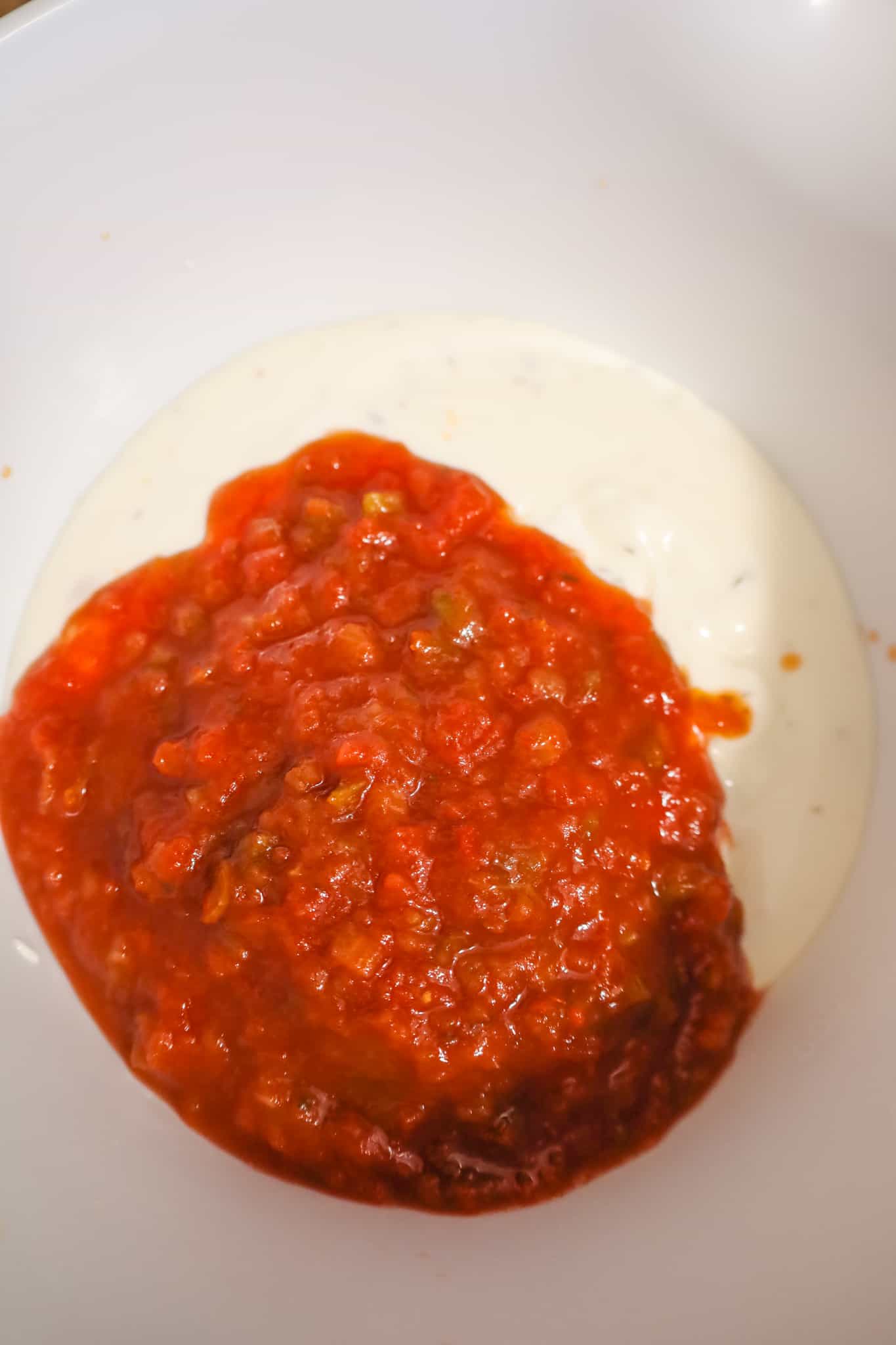 ranch dressing and salad in a mixing bowl