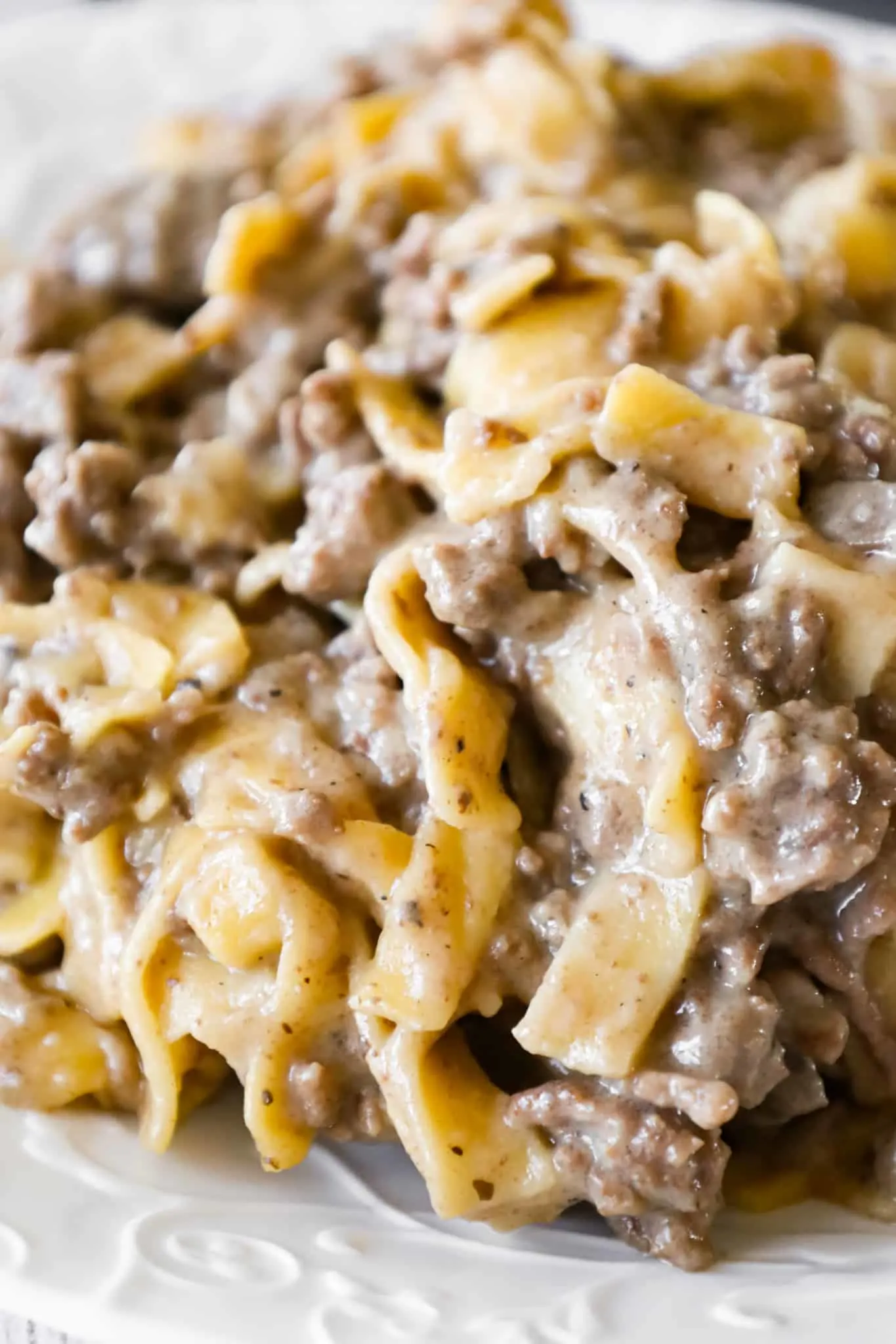 Crock Pot Beef and Noodles is an easy slow cooker dinner recipe loaded with ground beef and egg noodles cooked in a sauce made from beef broth and cream of mushroom soup.