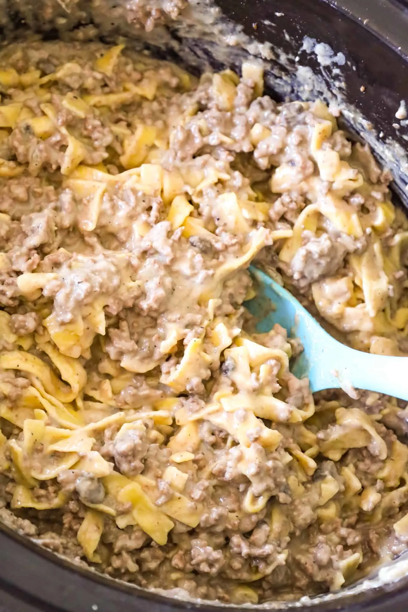 Crock Pot Beef and Noodles is an easy slow cooker dinner recipe loaded with ground beef and egg noodles cooked in a sauce made from beef broth and cream of mushroom soup.