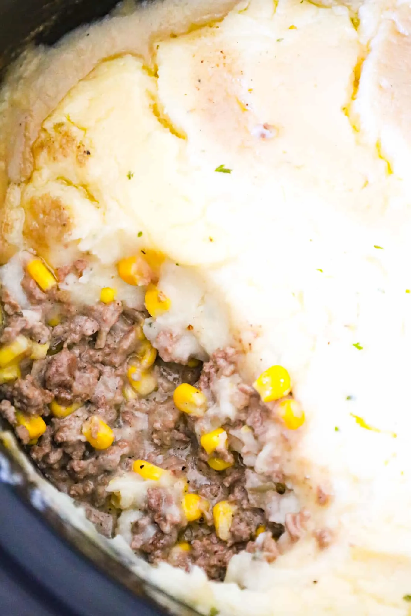 Crock Pot Shepherd's Pie is an easy slow cooker ground beef dinner recipe loaded with corn, cream of mushroom soup and mashed potatoes.