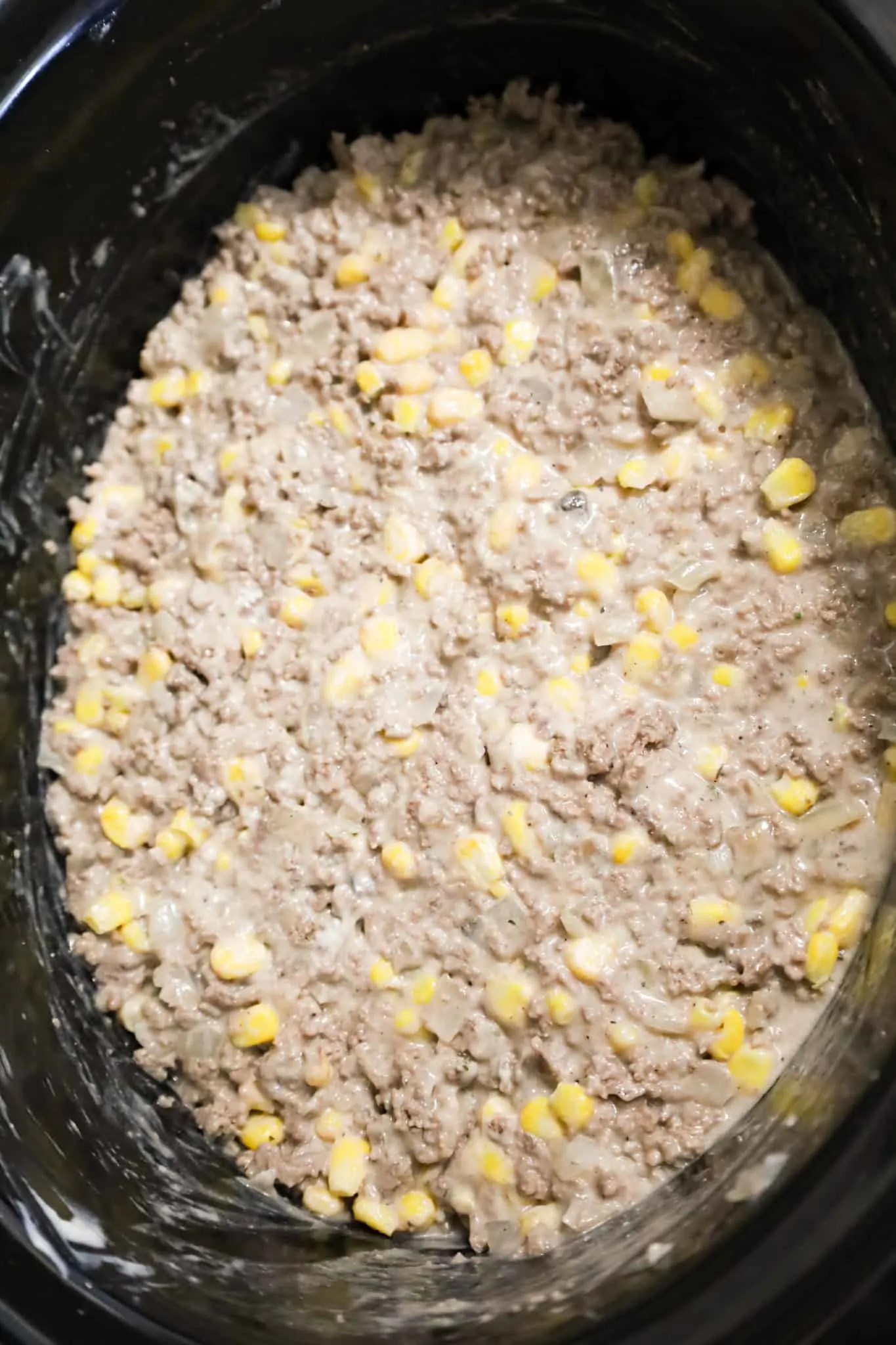 creamy ground beef and corn mixture in a crock pot