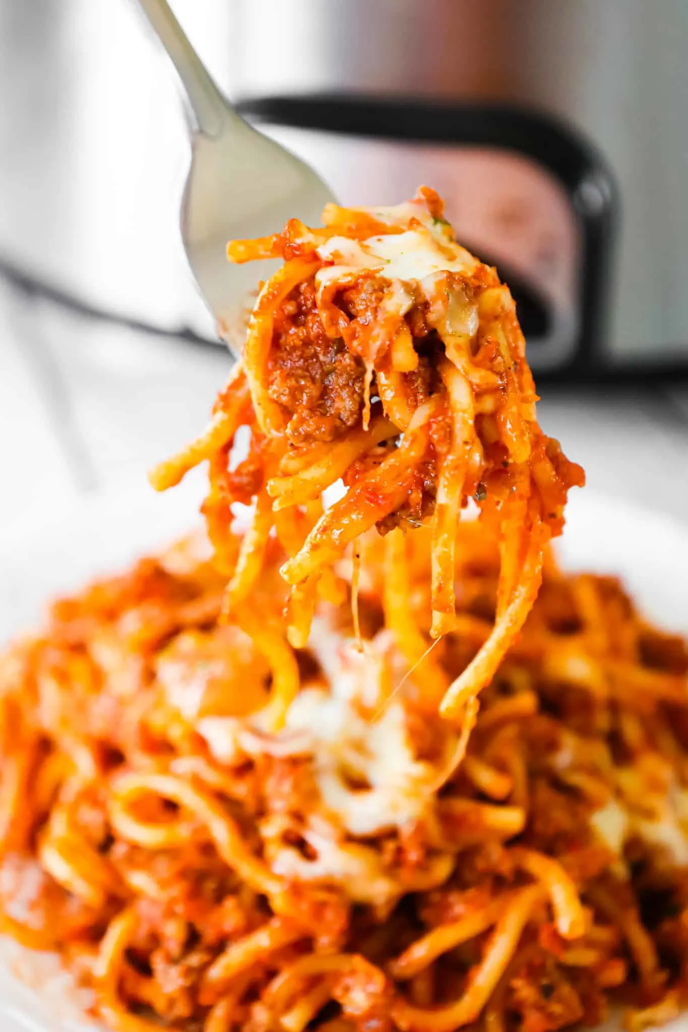 Crock Pot Spaghetti is a hearty slow cooker pasta recipe loaded with ground beef, marinara sauce and cheese.