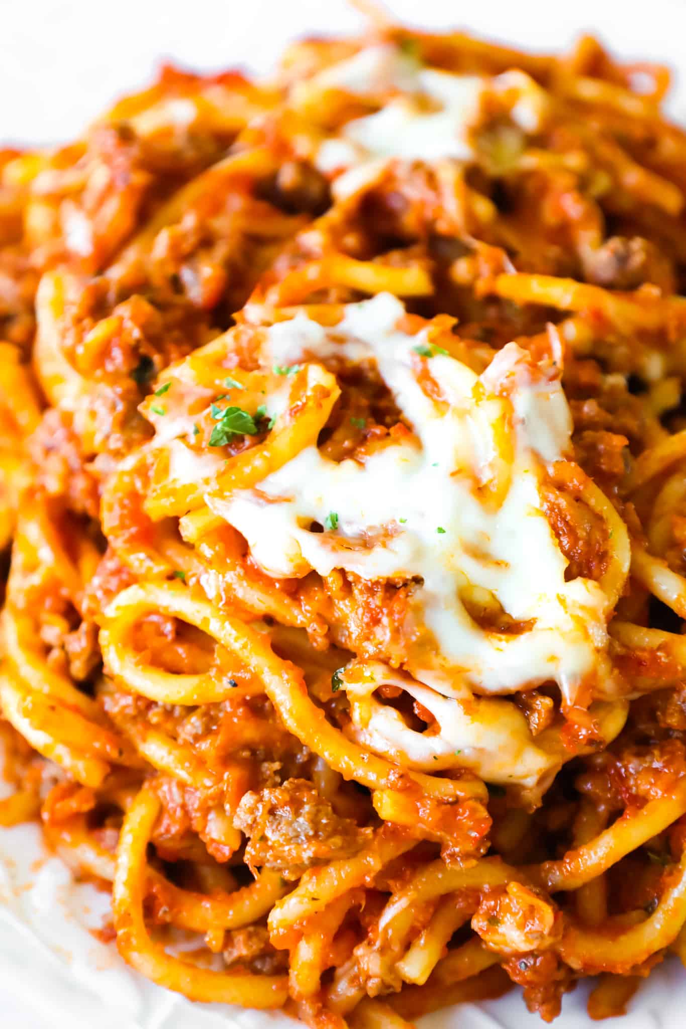 Crock Pot Spaghetti is a hearty slow cooker pasta recipe loaded with ground beef, marinara sauce and cheese.