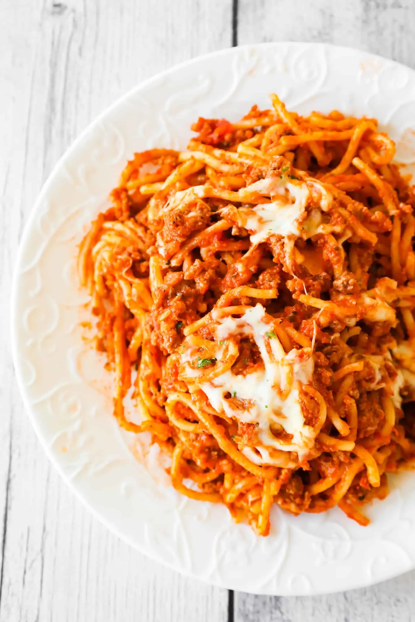 Crock Pot Spaghetti is a hearty slow cooker pasta recipe loaded with ground beef, marinara sauce and cheese.