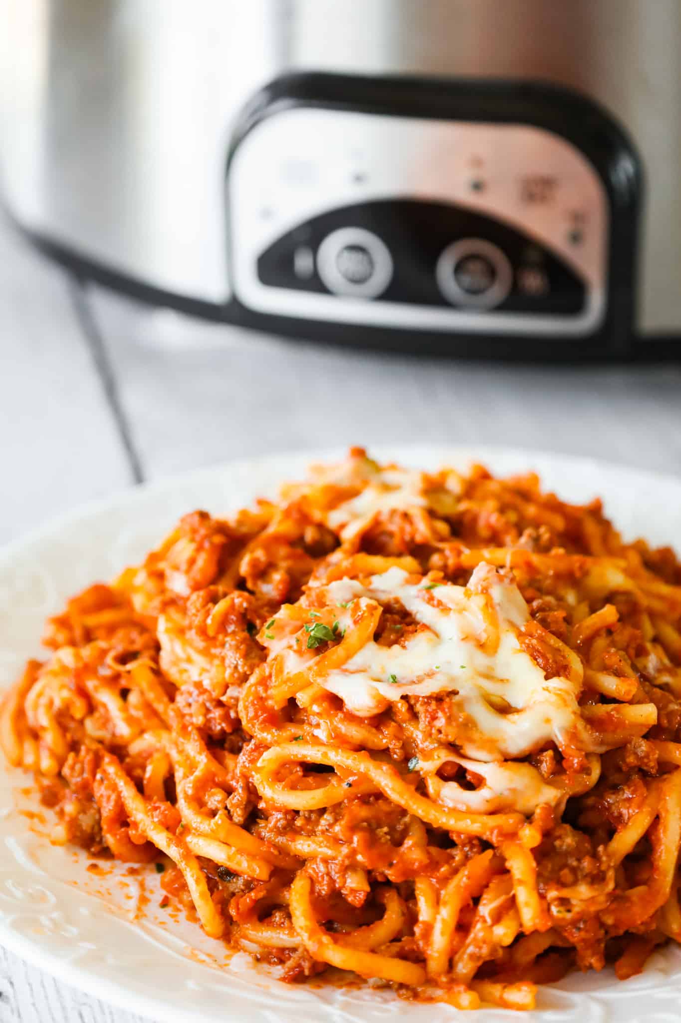 Crock Pot Spaghetti is a hearty slow cooker pasta recipe loaded with ground beef, marinara sauce and cheese.