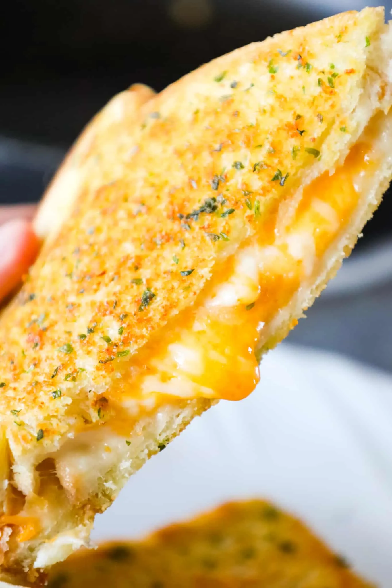 Garlic Bread Grilled Cheese is an easy lunch or dinner recipe with garlic buttered bread filled with gooey mozzarella and cheddar cheese.